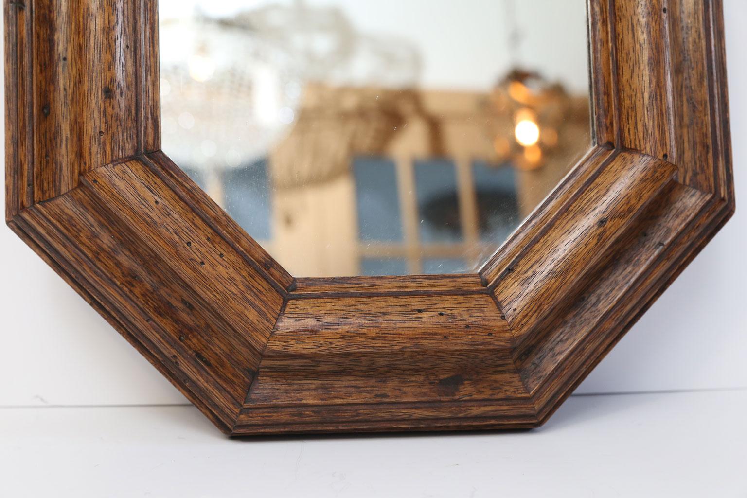 Italian vintage octagonal mirror in hand carved fruitwood with brass hanger. Made circa 1960s, all original. Gorgeous, rich patina.  This is a very nice quality vintage Italian mirror.