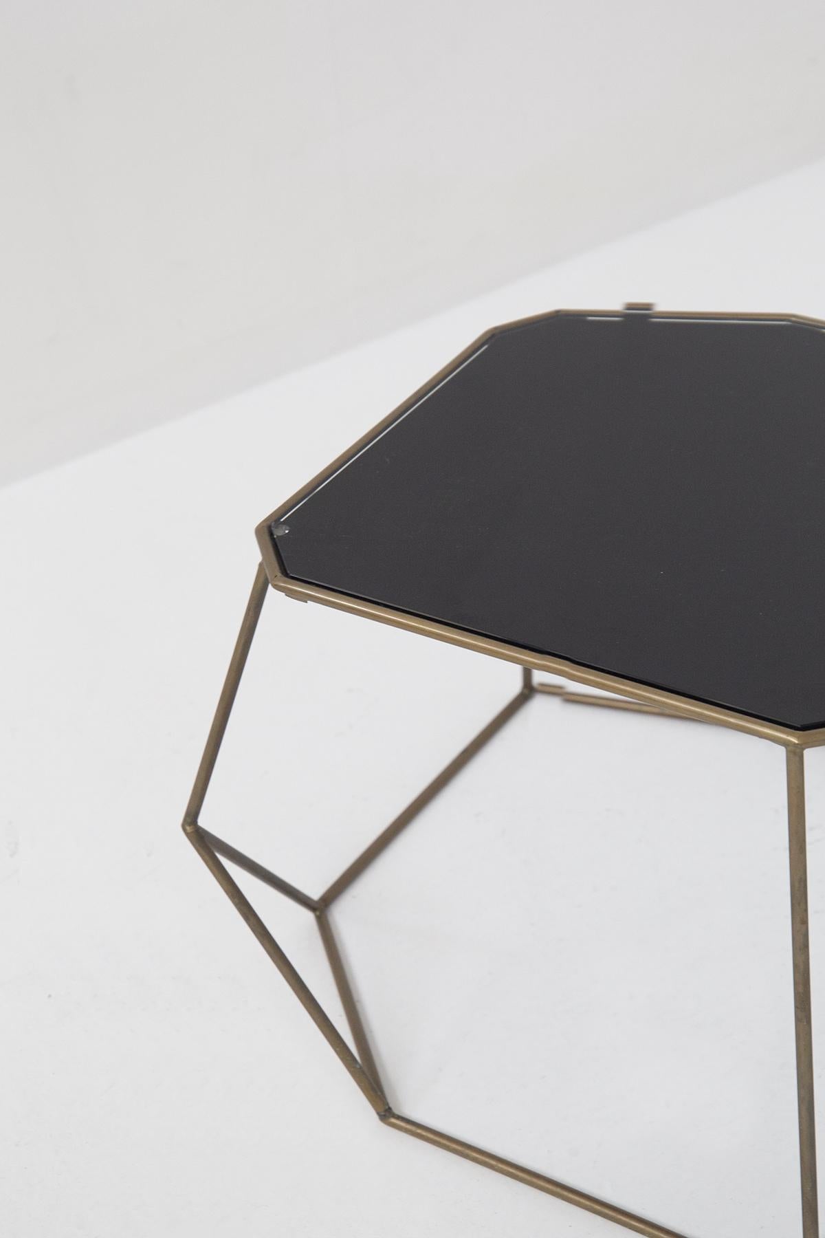 Beautiful pair of fine Italian-made coffee tables from the 20th century. 
The frame is made of brass tubing in perfect patina of very asymmetrical and playful geometric shapes, simply spectacular. The top is also asymmetrical in shape and is made