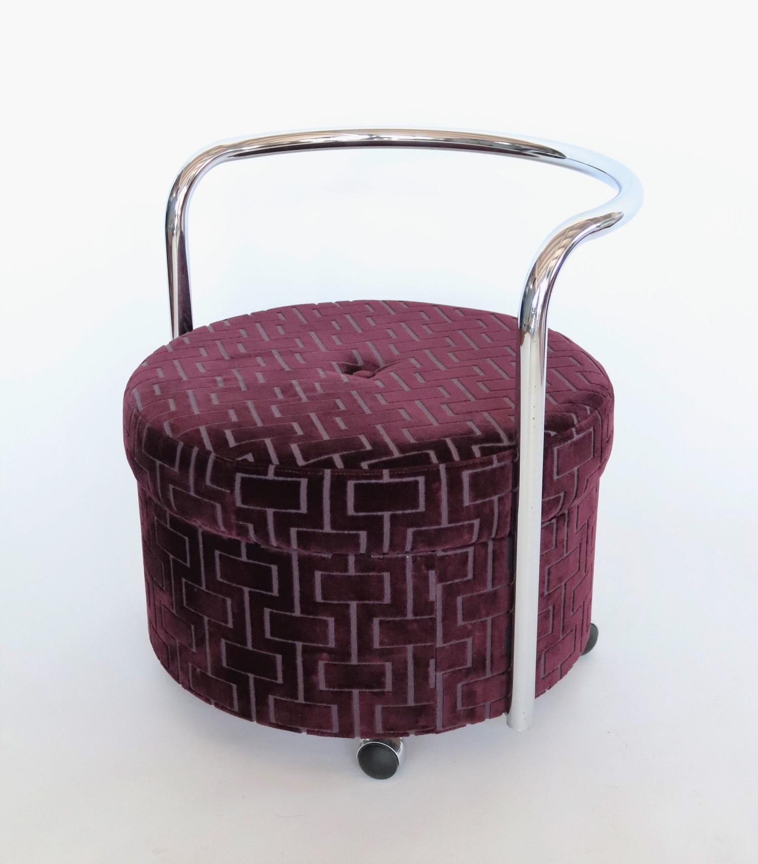Beautiful rolling design ottoman or pouf original from the 1970s with chromed curved backrest and four wheels.
The pouf have been re-upholstered with quality designer velvet in purple.
The wheels are rolling smoothly.
Beautiful vintage object in