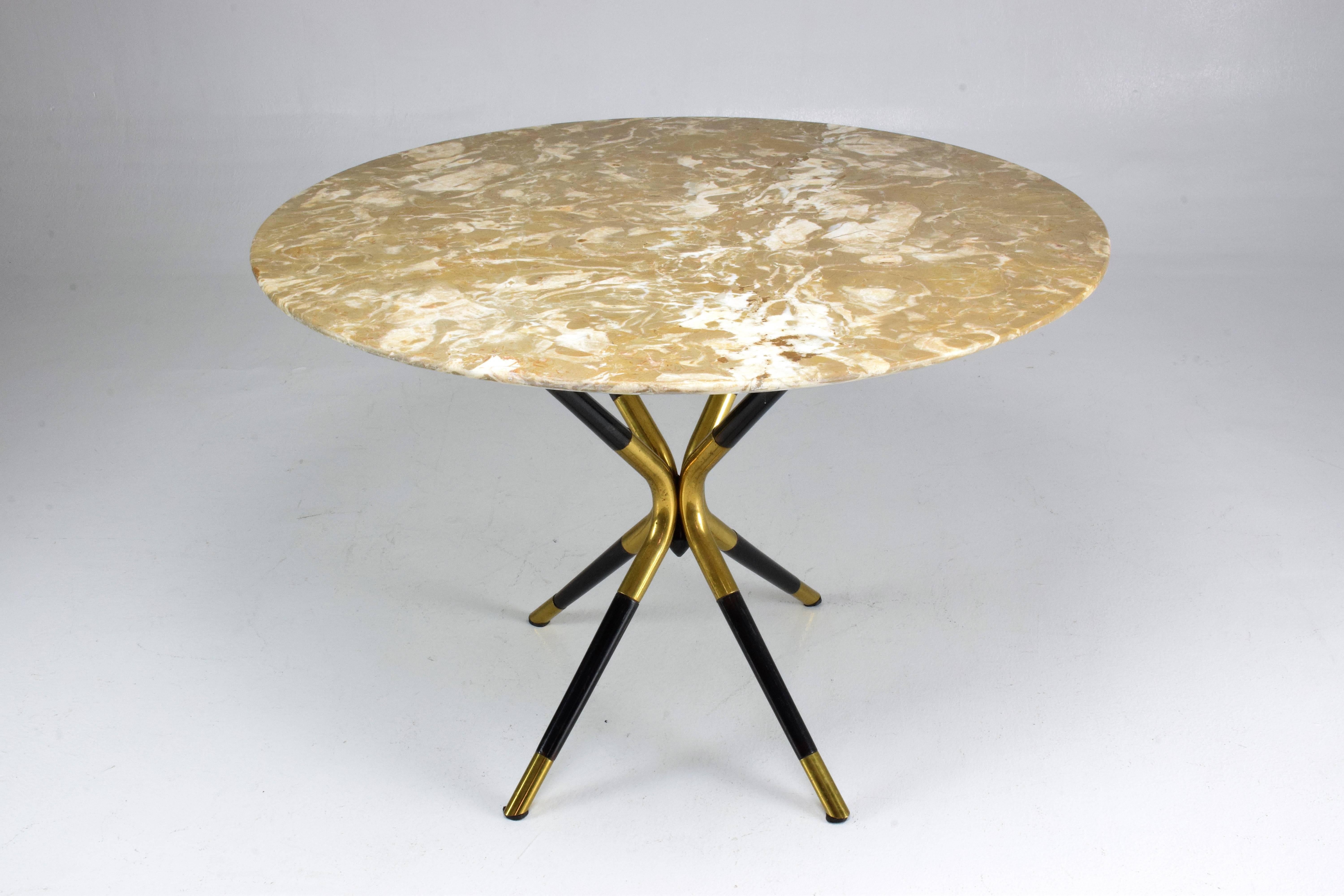 A 20th century vintage circular coffee or side table designed by Italian master Cesare Lacca circa 1950s and composed of a pink marble tabletop and his distinctive structure made of ebonized mahogany and solid brass.
 ---
Spirit Gallery is an