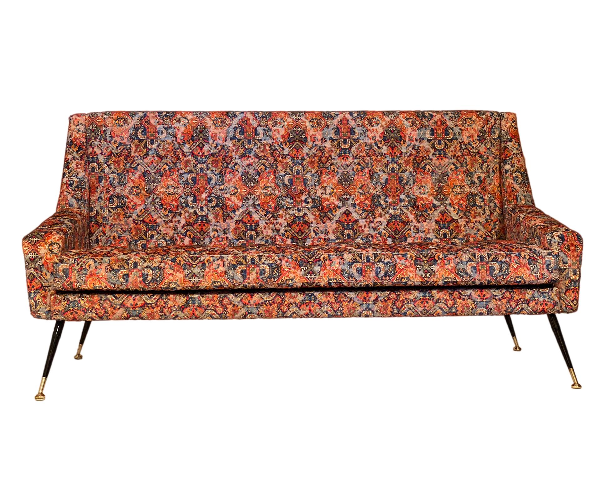 Vintage Italian sofa from Milan featuring unique Rubelli fabric mimicking an antique worn Persian rug. Steel and brass legs support this piece. We love this bold piece!