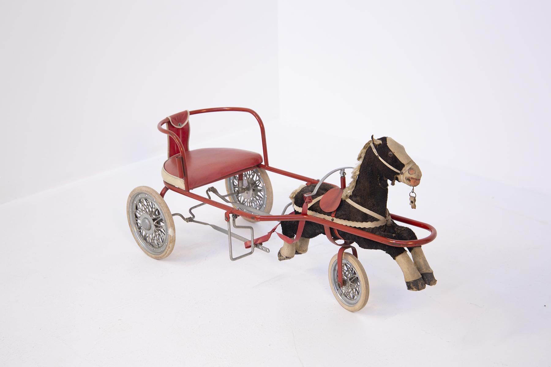 Nice vintage Italian toy of the 50's for girl, of Italian manufacture. The toy is a pretty carriage with its horse attached for little girl, the carriage still has working its pedals that allow the movement of the carriage to a single seat. The care