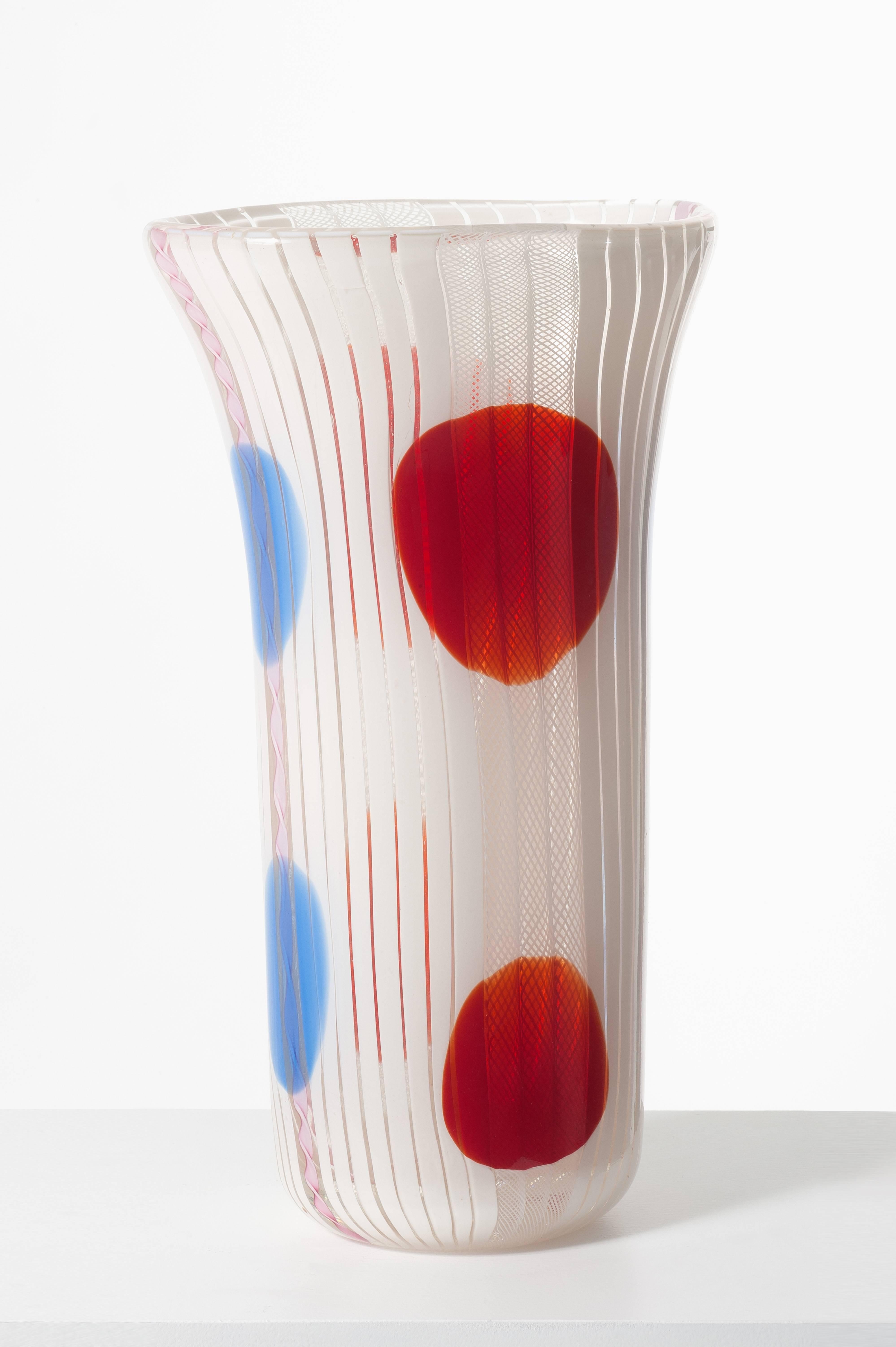 Vintage big white glass vase with geometric motive in blue and red glass manufactured by Avem Murano, Italy, circa 1955.

Measures: H 40 cm 23 x 19 cm.