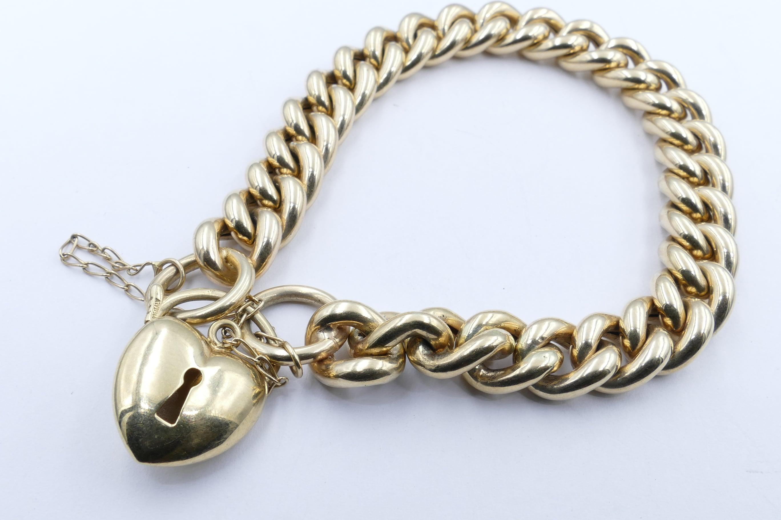 This Curb Link Bracelet is in excellent Condition & probably created in Italy just after the Art Deco period.
It measures 22cm in length & 10.17mm wide with a Heart Locket to form the clasp.
A great 'every day' addition to any wardrobe.
Total Item