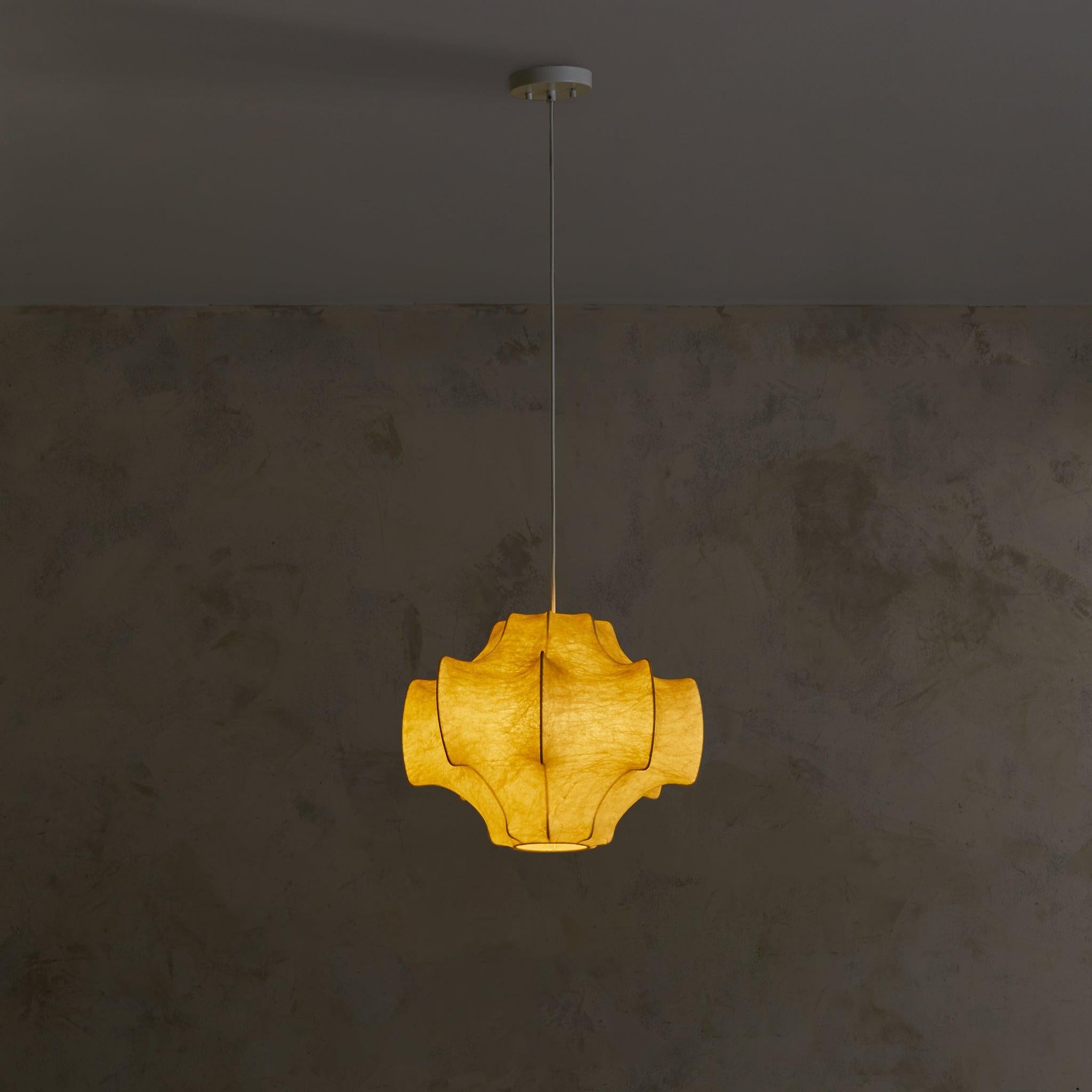A small ‘Viscontea’ cocoon pendant light designed by Achille 
Pier Giacomo Castiglioni for Flos in 1962. This captivating fixture features an enameled steel frame and a “cocoon” sprayed resin shade, mimicking the look of goatskin parchment.