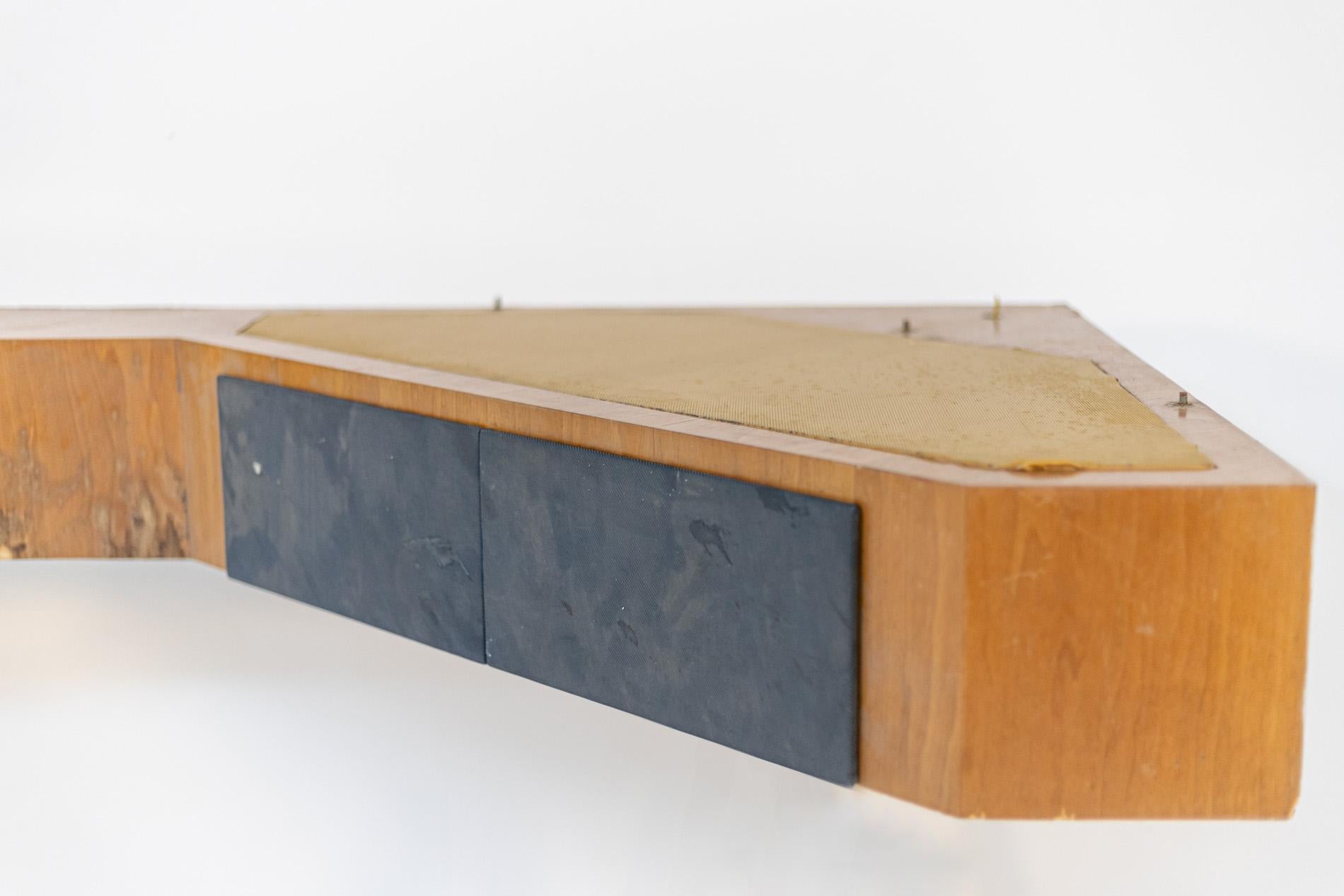 Large Italian console or wall shelf from the 1950s. The console is attributed to the great designer Melchiorre Bega because of its shape and line. The structure is made of walnut wood. The peculiarity of the console is its large protrusion of