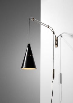 Italian wall light 50's counterweight in brass and metal attributed to Oluce