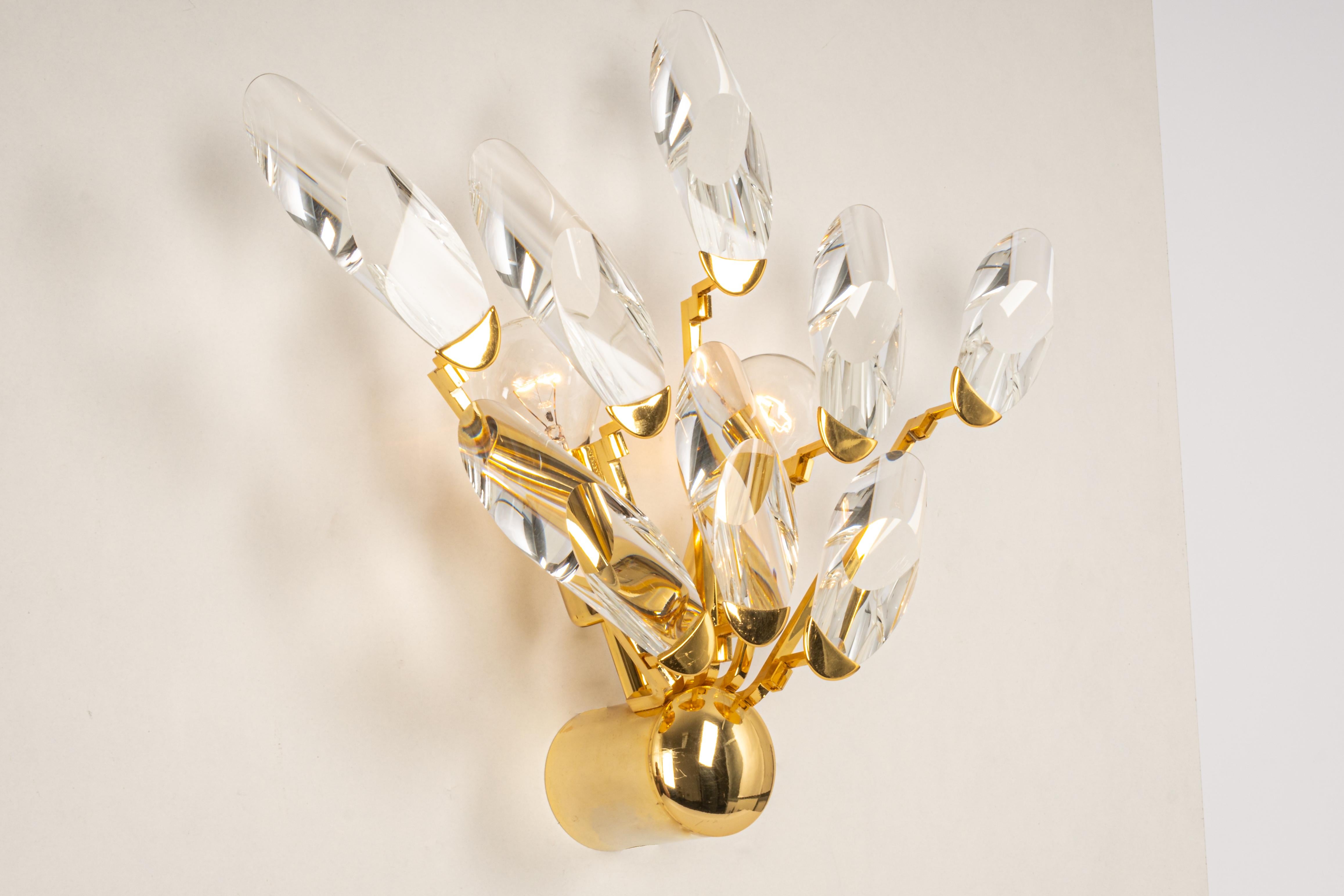 Stunning wall light by Stilkronen, Italy, manufactured in mid-century ( 1960s / 1970s). It is made of gold-plated( 24 Carat) brass with cut glasses.

High quality and in very good condition. Cleaned, well-wired and ready to use. 

The fixture