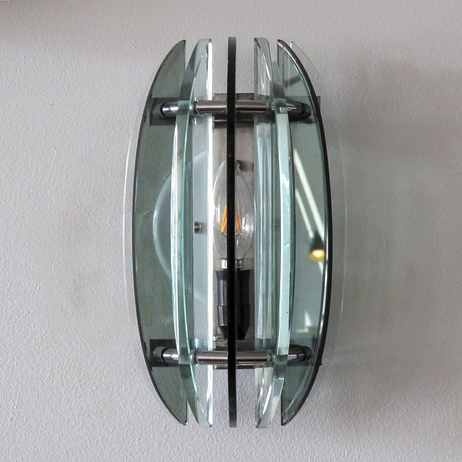 Wonderful Italian glass wall lights by Veca, with alternating clear and green glass panels on a nickel-plated frame. Custom back plates for US j-boxes, rewired for US, one E12 socket per fixture, max. wattage 60w per socket, bulbs provided as a