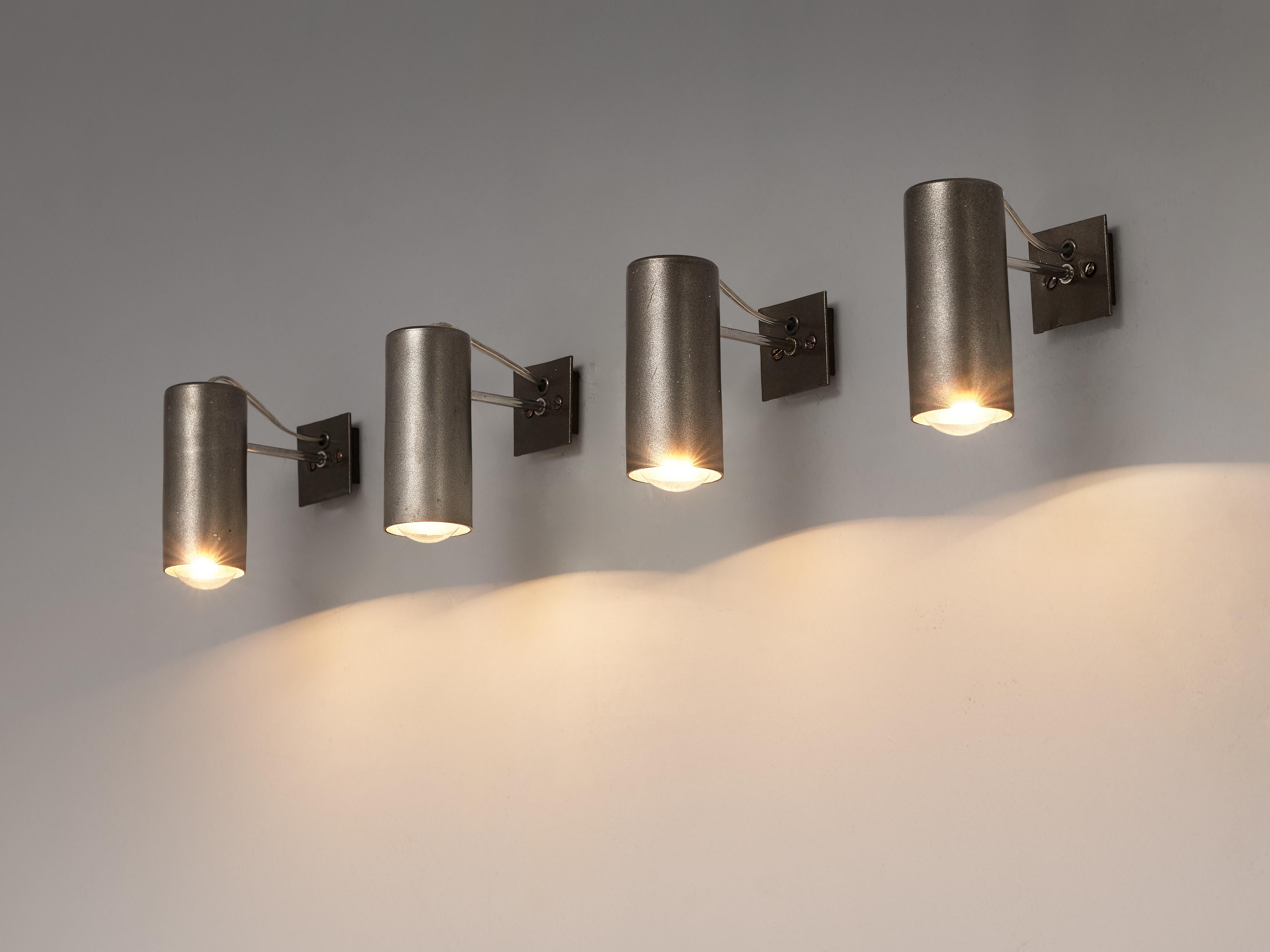 Gino Sarfatti for Arteluce, wall lights, model 36, metal, Italy, 1957. 

Set of wall lights designed by Gino Sarfatti for Arteluce. These metal wall lights are formed out of a cylindrical metal shade at which end a light bulb shows. The shades are
