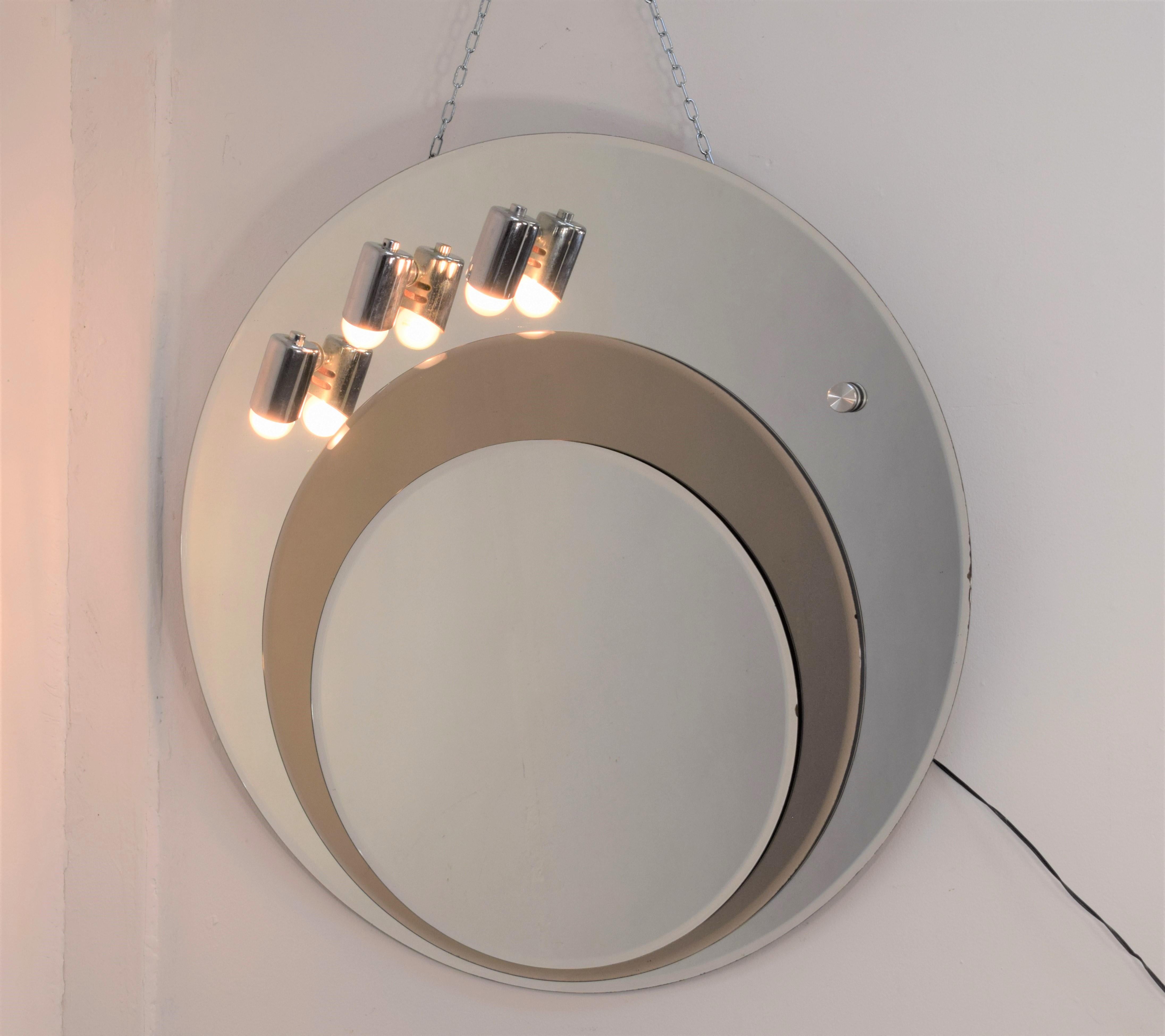 Italian wall mirror, 3 lights, 1970s.

Dimensions: D= 82 cm; Depth= 6 cm.