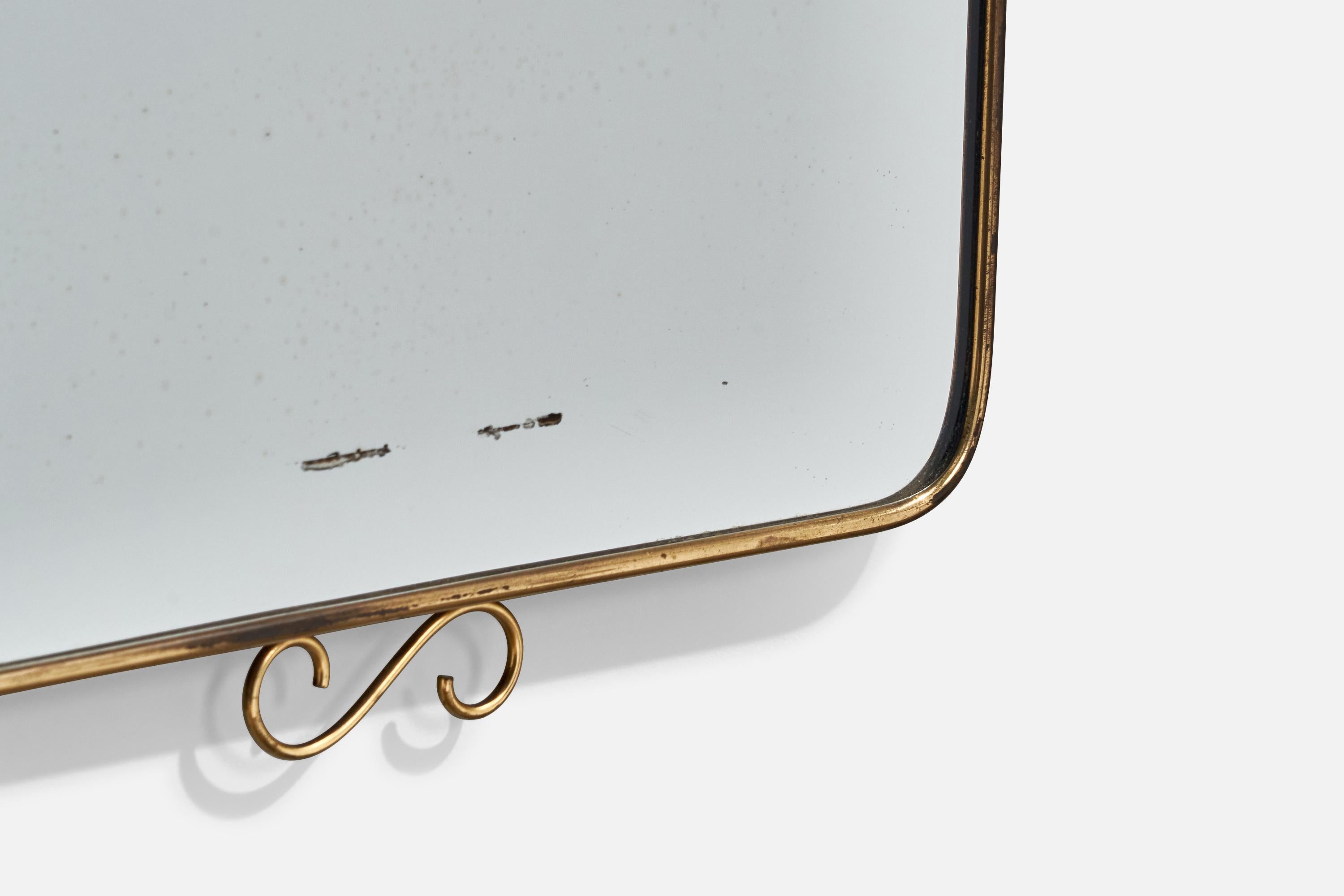A brass wall mirror designed and produced in Italy, c. 1940s.