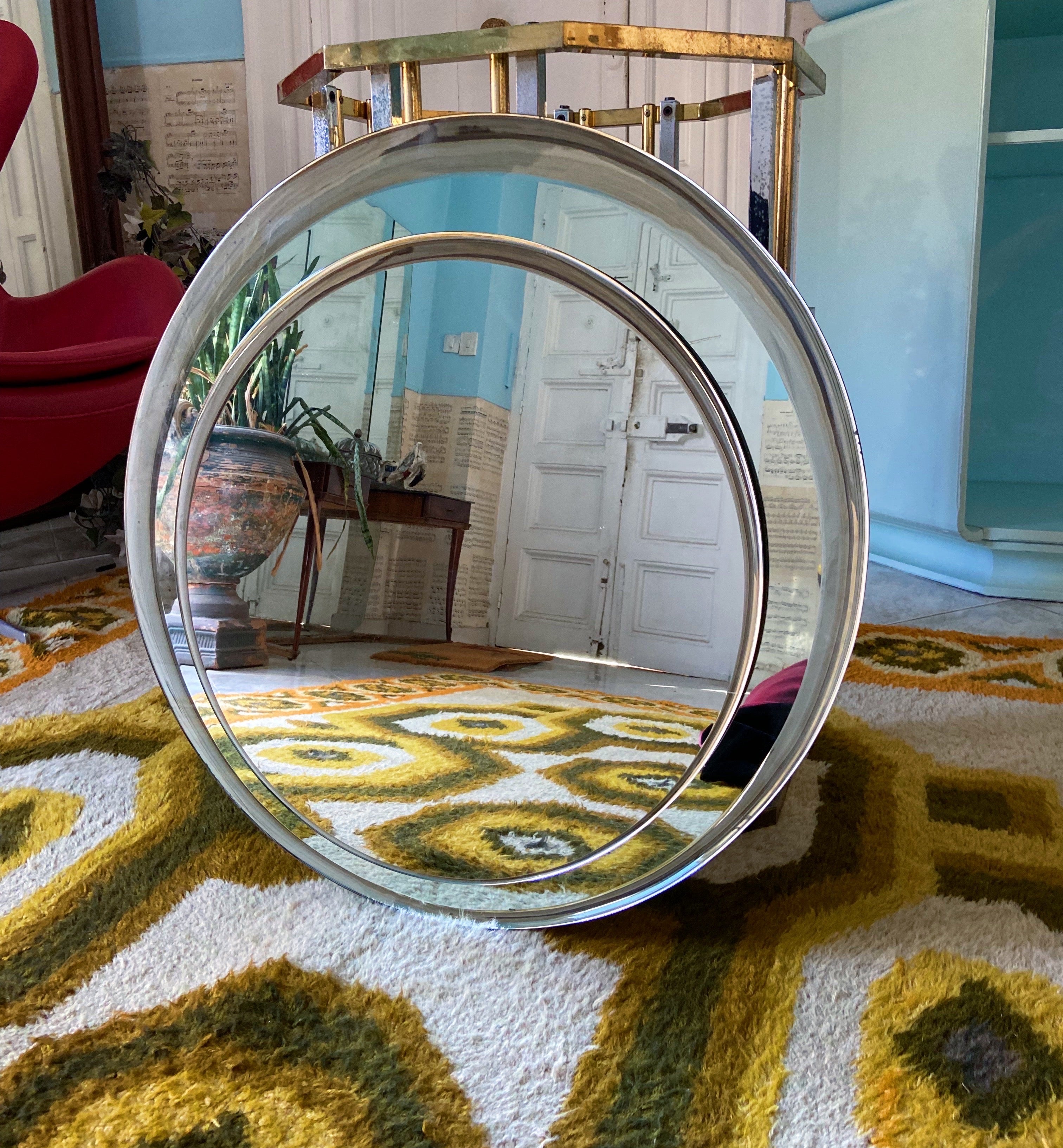 Elegant two-circle mirror by Cristal Art, Italy circa 1960. Designed by Franz Sartori. 
The glass is extremely thick and you really feel the high quality that Cristal Art always delivers. Its multiplied round shaped can be played around with since