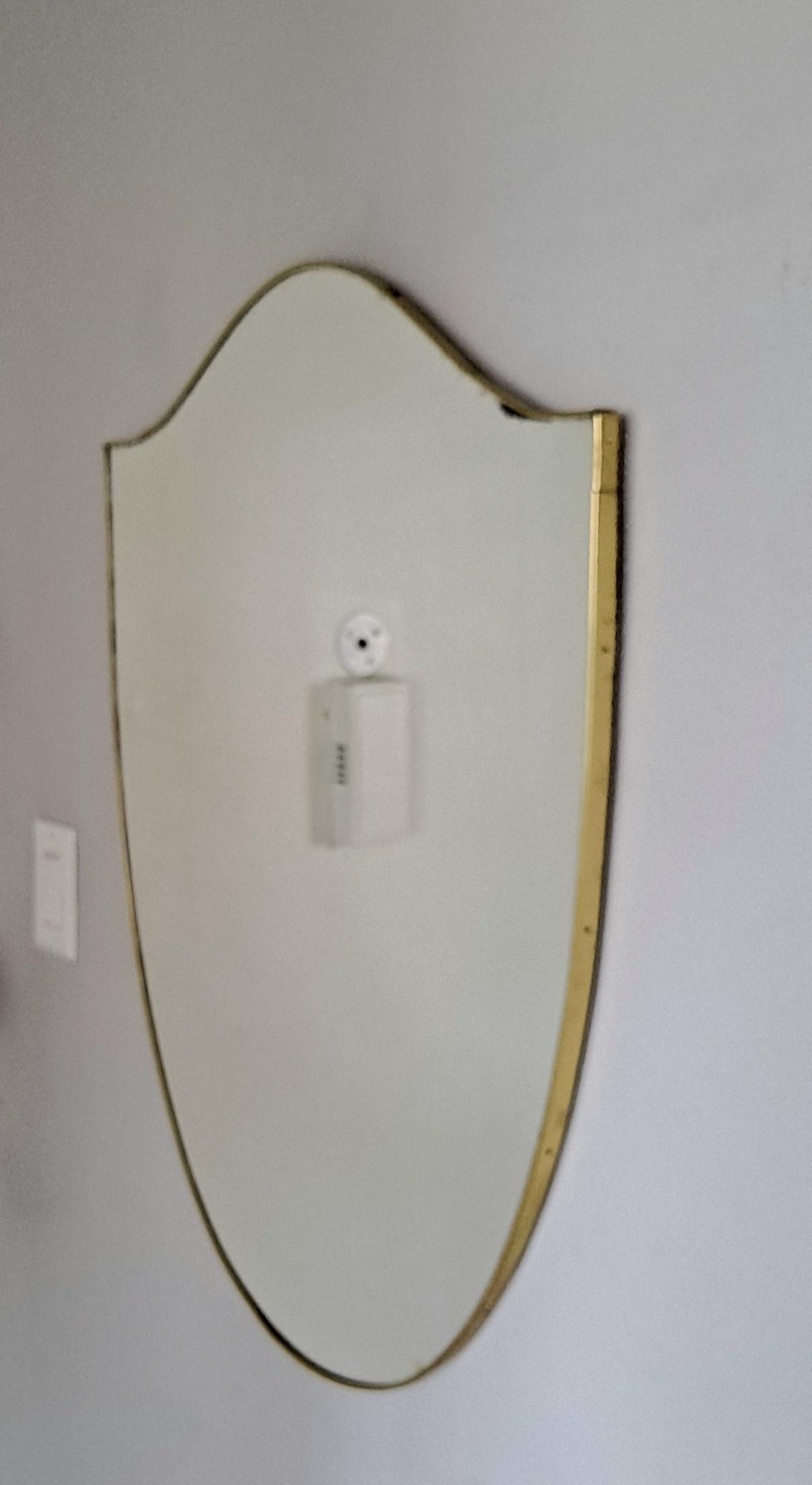 Mid century wall mirror frame and the mirror from the 1950 s period.