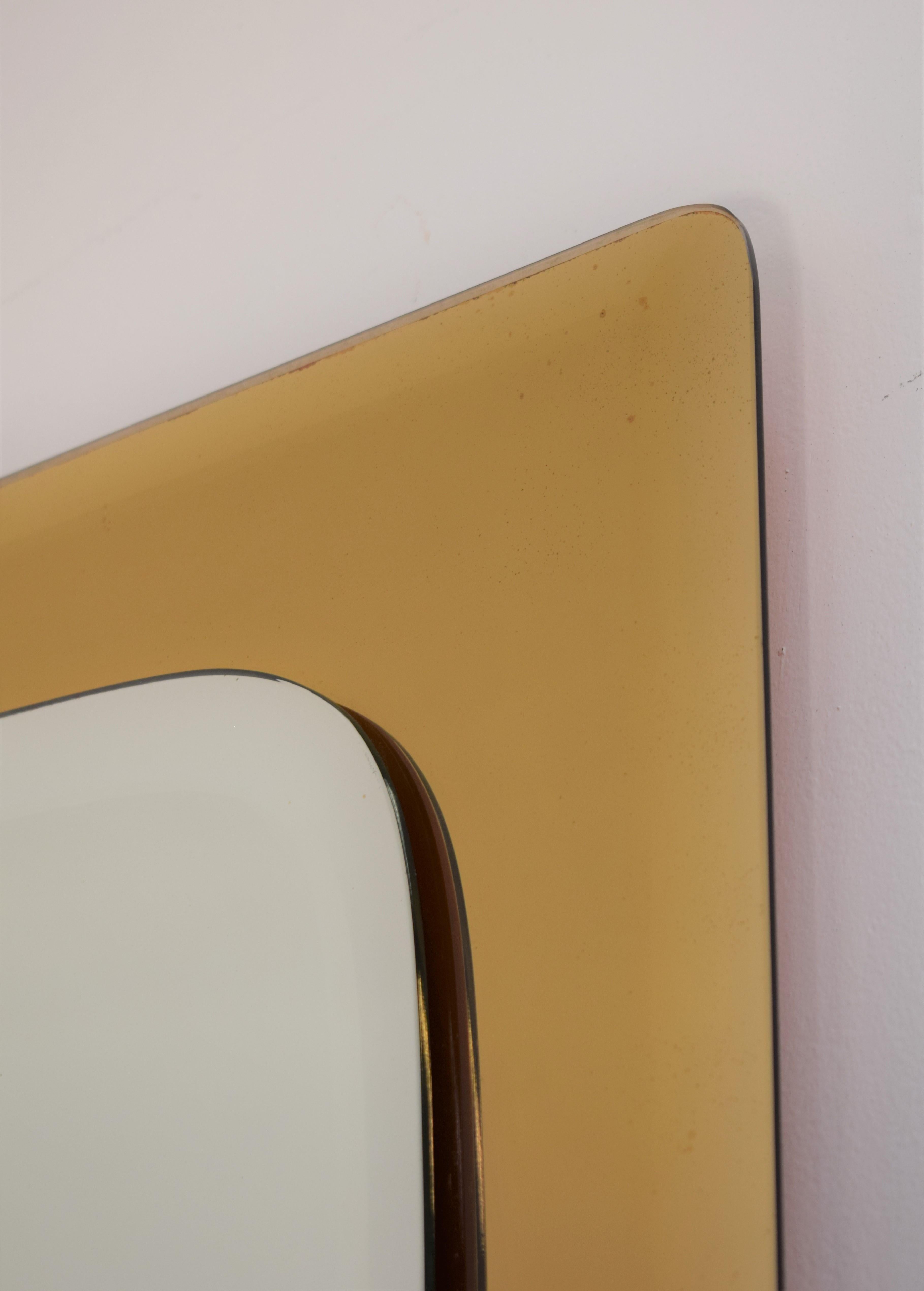 Italian wall mirror in the style of Fontana Arte, 1960s.
Dimensions: H= 90 cm; W= 70 cm; D= 1 cm.
  