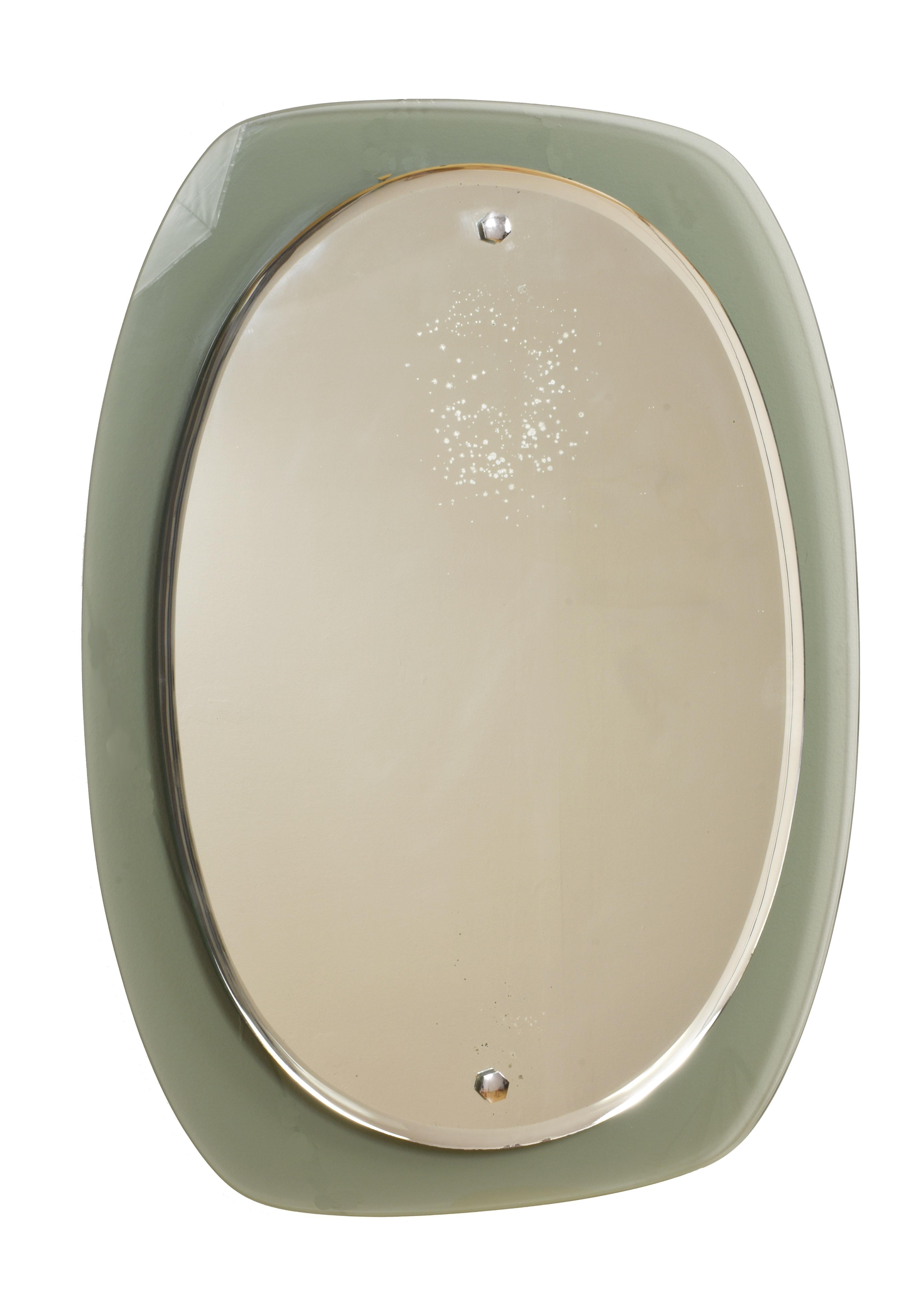 This bevelled mirror was produced in the 1960s. It features a caramel glass frame and nickel-plated brass screw heads.