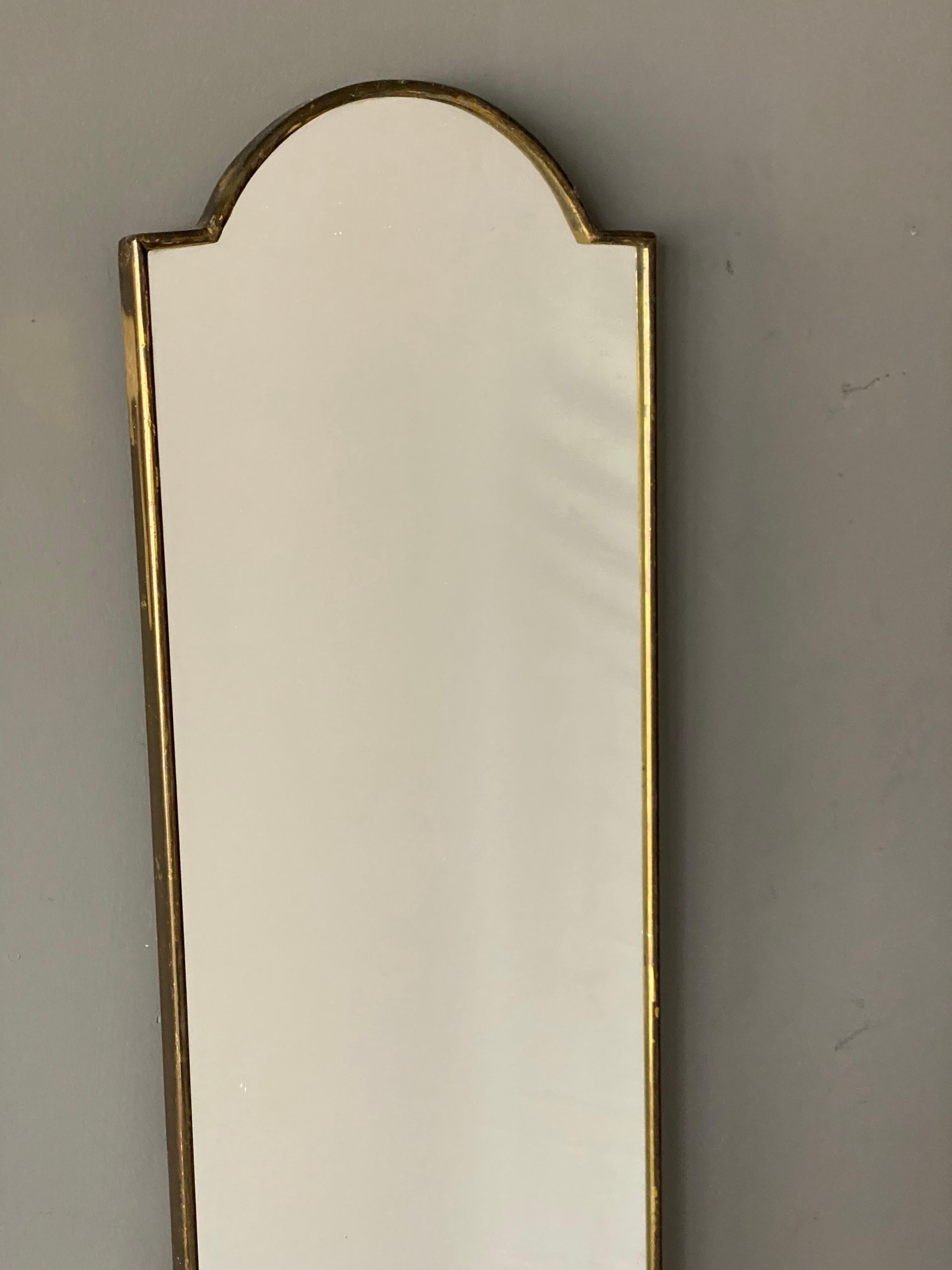 A pair of large wall mirrors, produced in Italy, 1940s-1950s. Cut mirror glass is framed in brass. 

Other designers of the period include Gio Ponti, Fontana Arte, Max Ingrand, Franco Albini, and Josef Frank.
