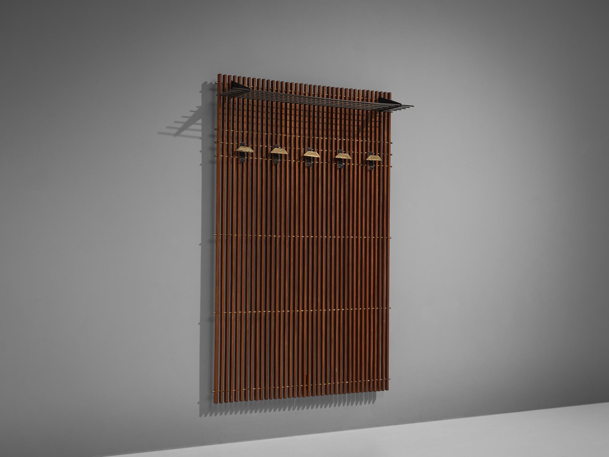 Hall-stand with hangers and a shelf, mahogany, brass, metal, Italy, 1950s

This hall-stand is characterized by vertical adjusted slats in mahogany. Four adjustable hangers and a shelf allow you to arrange your coats in a preferred way. The shelf