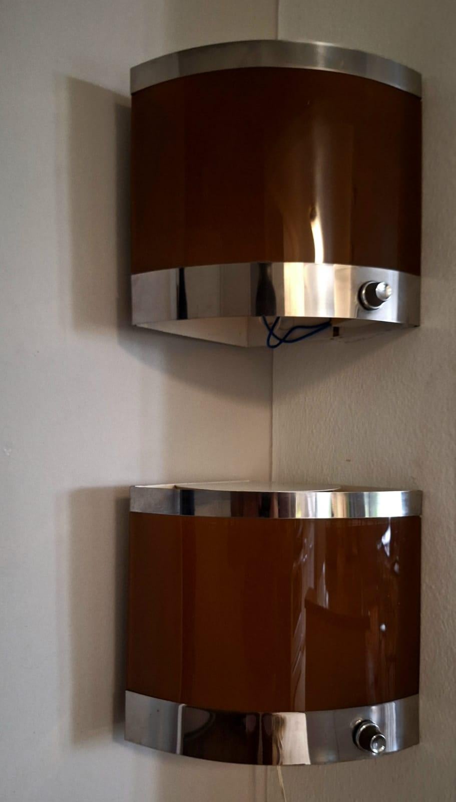 Italian corner wall sconces from the 70 s .On the  botom part of the wall sconce is a dimer switch .
 light  can be regulated on the spot .