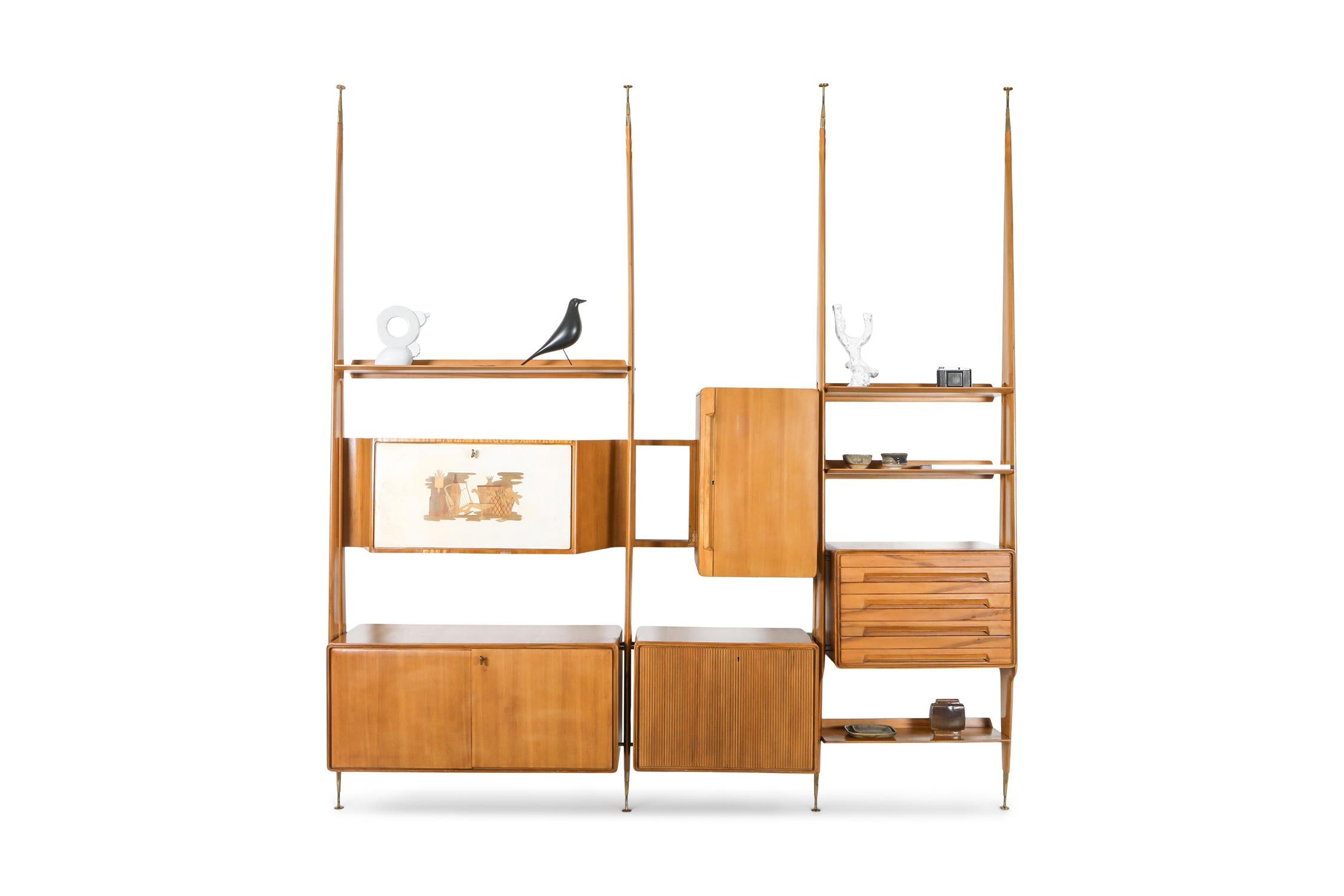 Gio Ponti, wall unit, shelve system, beech, Italy, 1950s

Diverse shelving unit style of Gio Ponti
The composition of this unit comprises 5 storage pieces, 4 large shelves and 4 stands.
As the system is modular one can choose which piece hangs