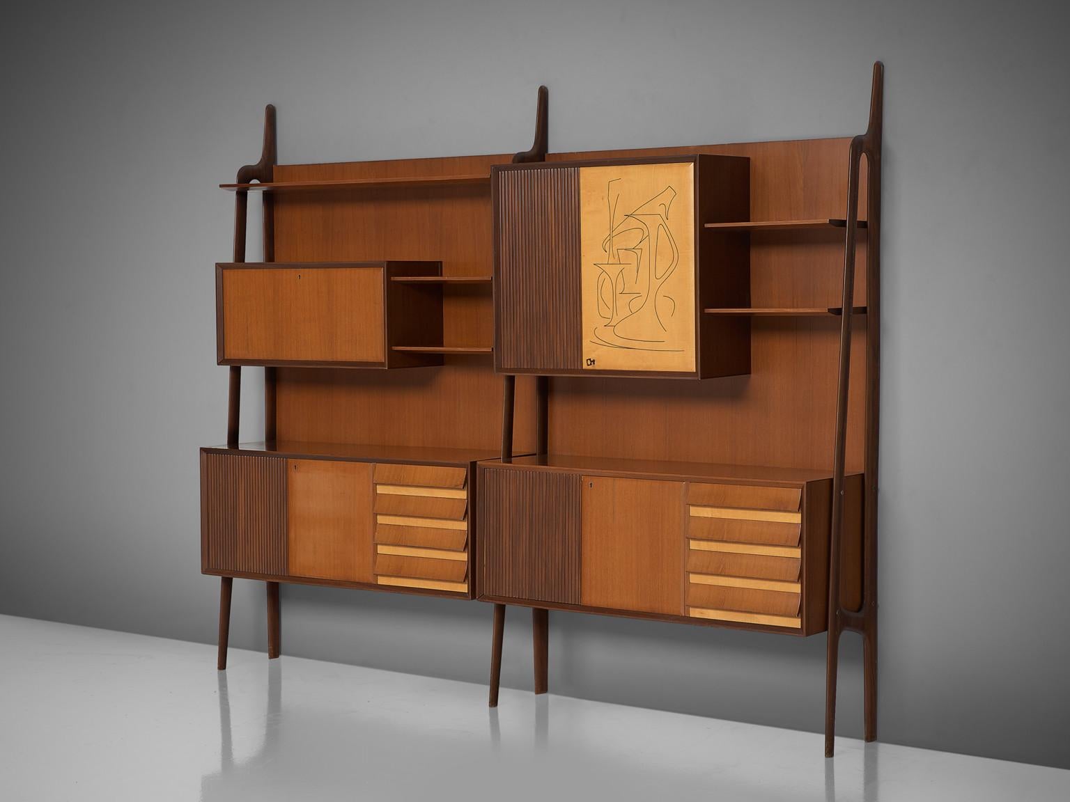 Cabinet, in rosewood, maple, brass and wood, Italy, 1950s.

Rare Italian wall unit in the style of Ico Parisi, Paolo Buffa and Vittorio Dassi on subtle tapered legs. This characteristic Italian cabinet is equipped with doors, drawers, shelves and