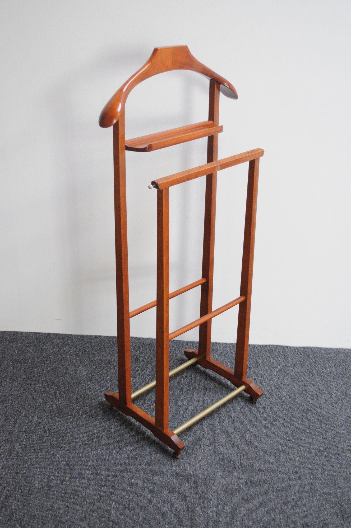 This Italian valet was designed by Fratelli Reguitti in the 1950s. Unique example with two-segment construction composed of a frame/hanger and change or cufflink holder with a separate front section with bar intended for hanging scarves, ties, or