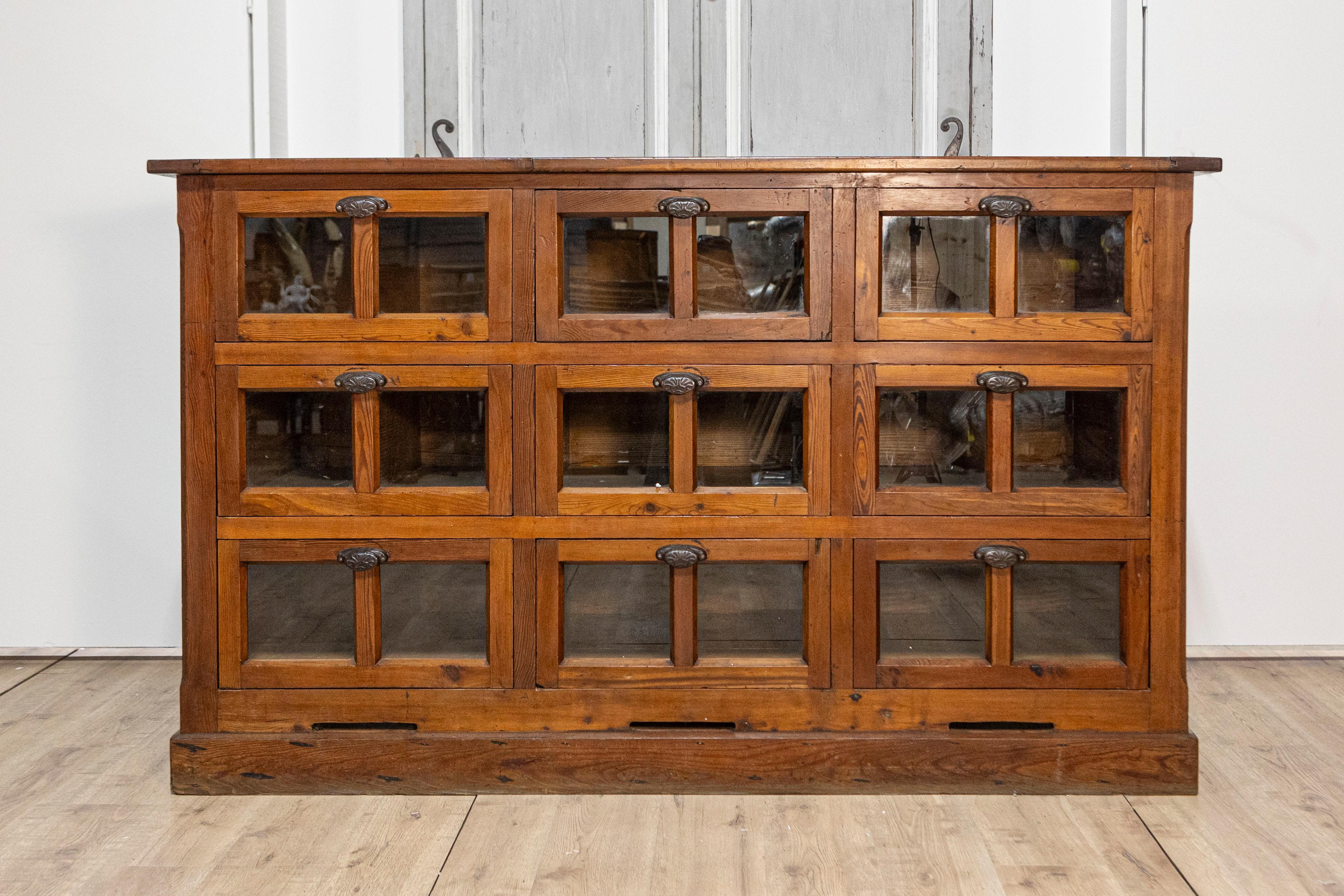 20th Century Italian Walnut and Iron Pastaia Shop Cabinet with Nine Drawers and Glass Panels For Sale