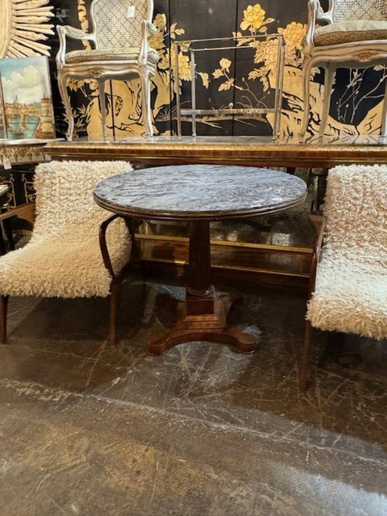 19th century Italian carved walnut center table with grey marble top. Circa 1860. A fine addition to any home! 39w x 31.5h