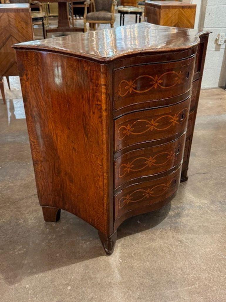 19th century Italian shaped front inlaid walnut 4-drawer chest. Italian shaped-front inlaid walnut chests offer rich wood grain, curvaceous silhouettes, and intricate marquetry. Circa 1860. 32.5w x 18d x 31.5h
