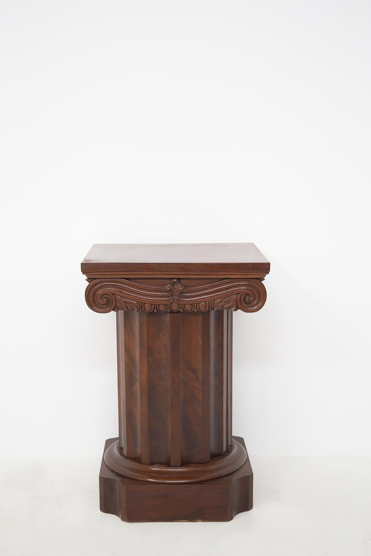 Classic and elegant Italian cocktal console table from the 1800s. Made in walnut . The console table is made with a typical Ionic column shape. Made with great skill the console hides a secret. The column opens through a door and inside there are