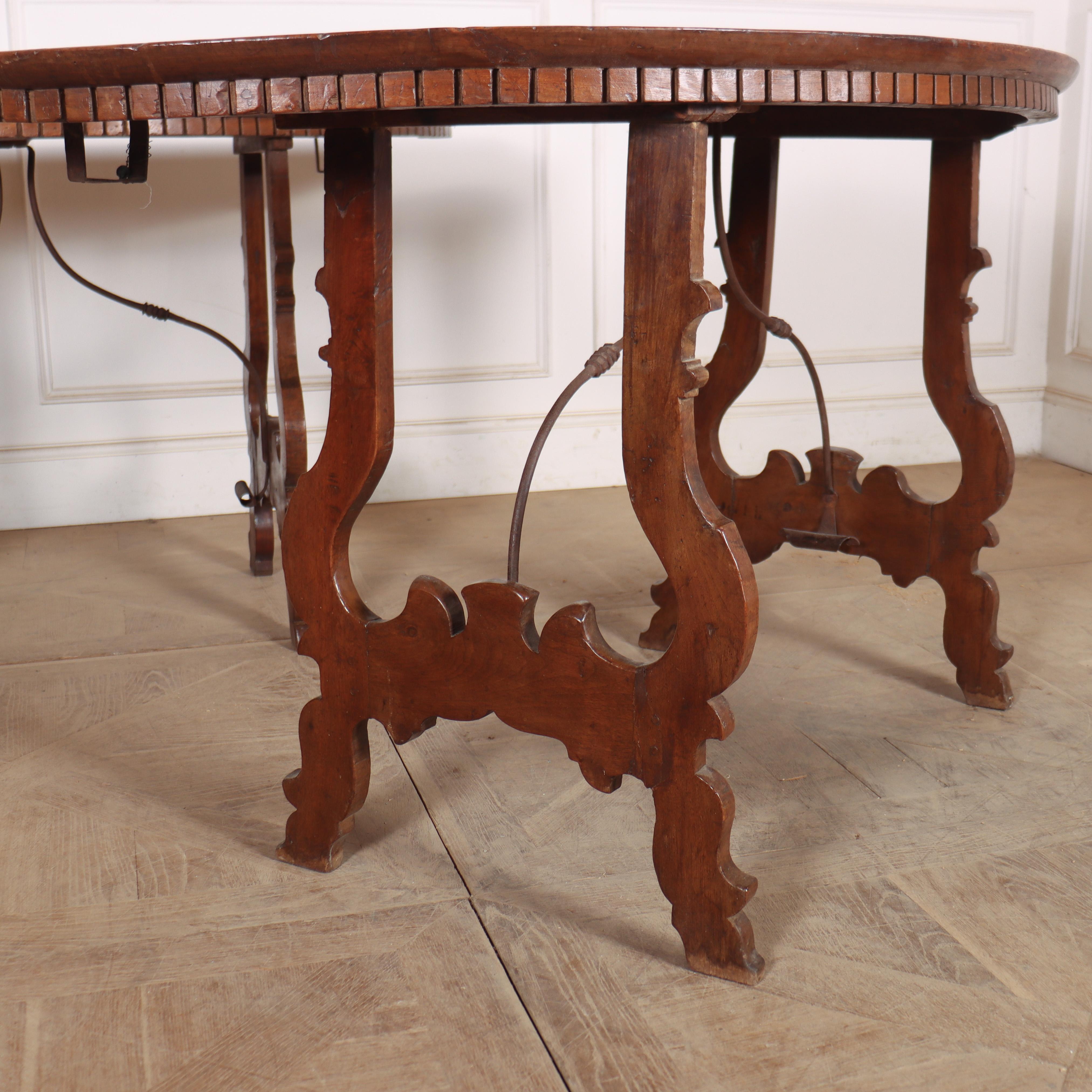Good pair of 18th century Italian walnut console tables with decorative shaped legs and an iron shaped stretcher. 1760. 

When tables are together, the circumference is 60-inches. 


Code: 8951

Dimensions:
W: 60.5