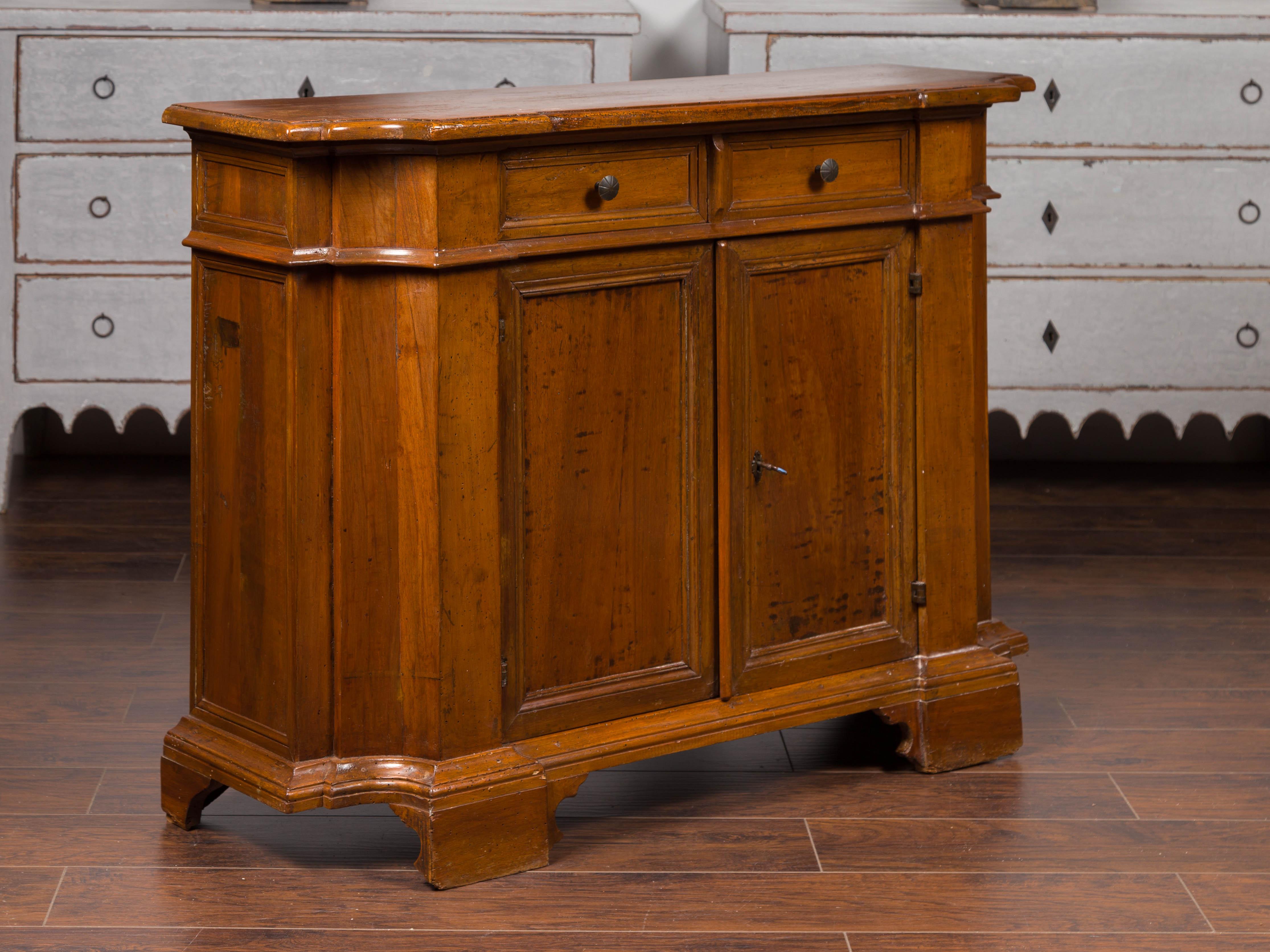 19th Century Italian Walnut Credenza with Drawers over Doors and Curving Sides, circa 1860