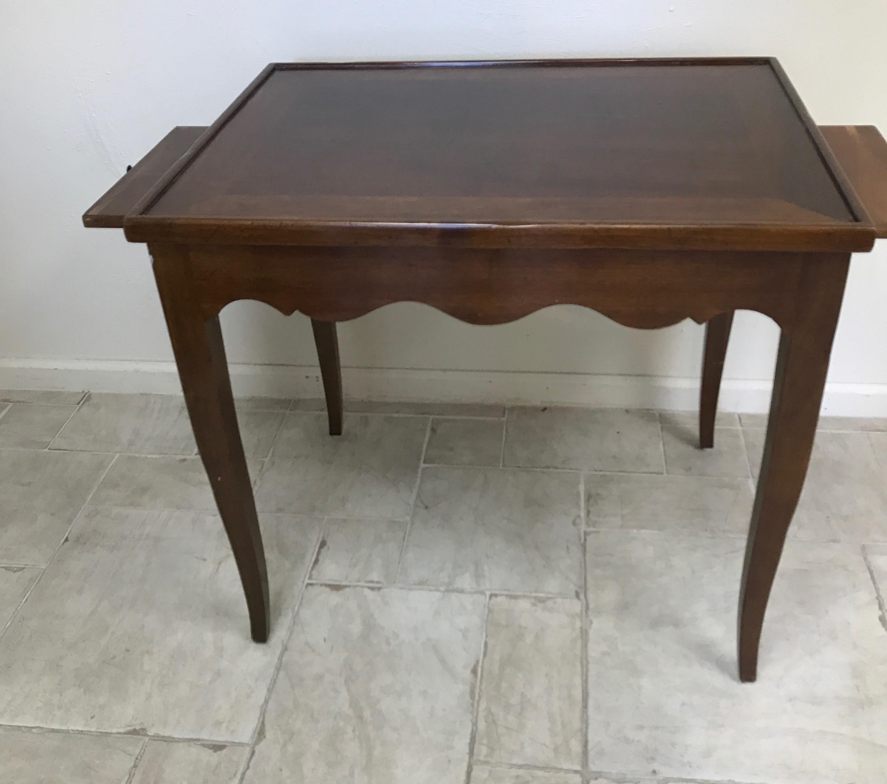 Louis XV style Italian walnut game table with flip top and side pull out extensions.
One side of top is plain and the other side is inlaid chess board.