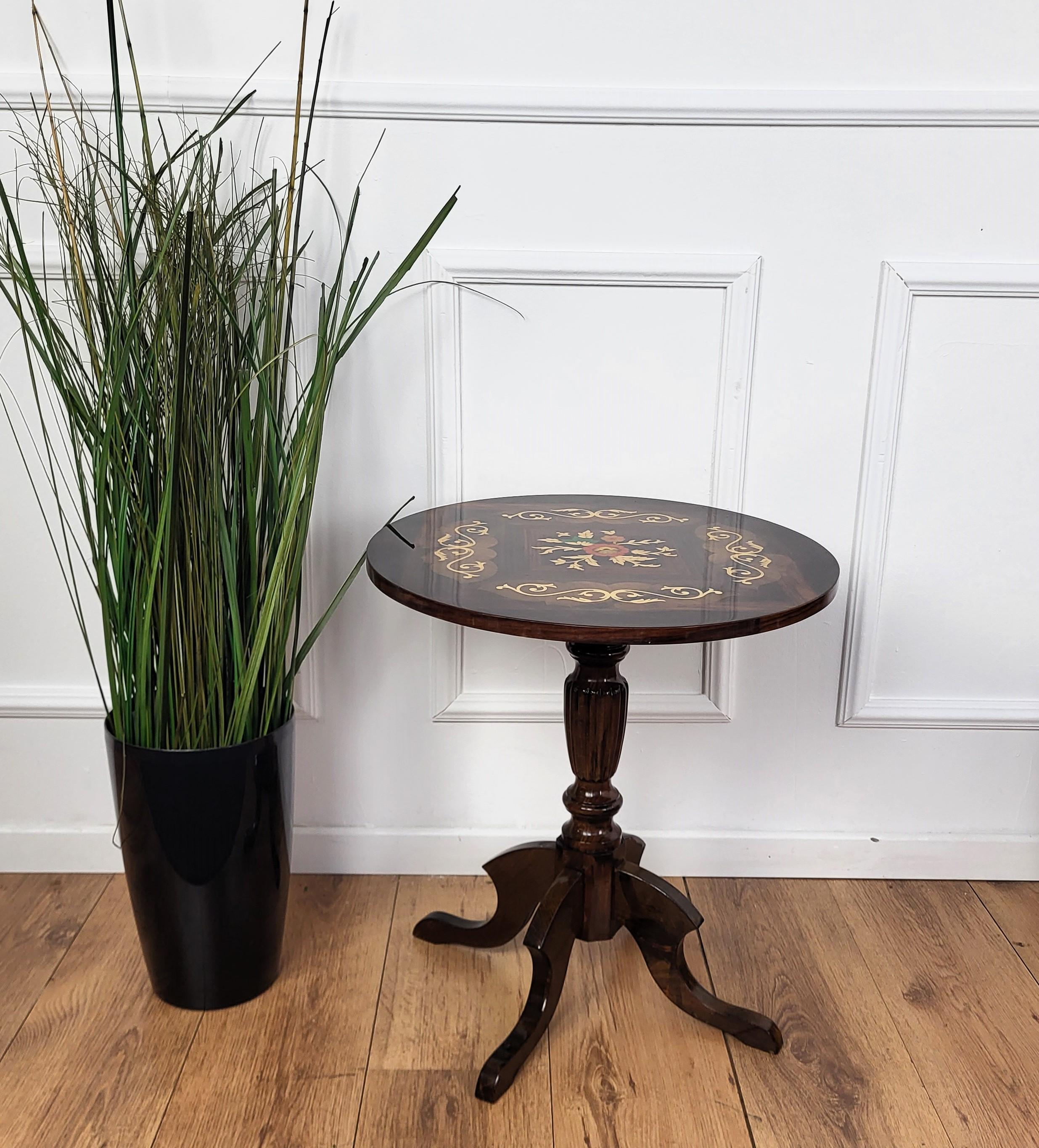 A beautiful Italian round side table with great details and frames shaped in Victorian, Napoleon III, Louis XV style with beautiful inlay decors in classic figures on the top astanding on tripod feet legs. A very elegant, modern and classic piece