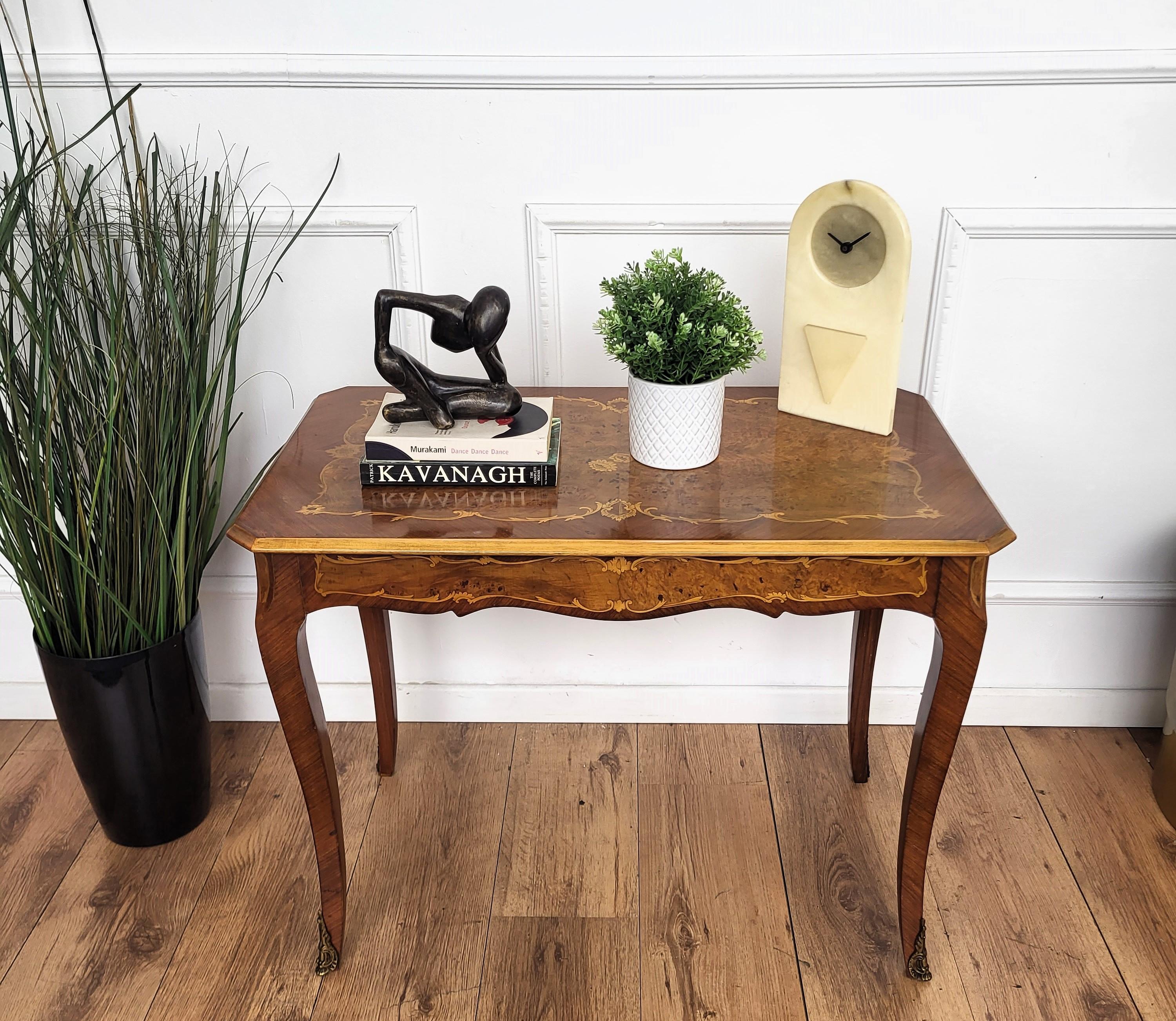 A beautiful Italian side table with great details and frames shaped in Victorian, Napoleon III, Louis XV style with beautiful inlay decors in classic figures on the top and sides standing on saber legs and ormolu brass decor feet. A very elegant,