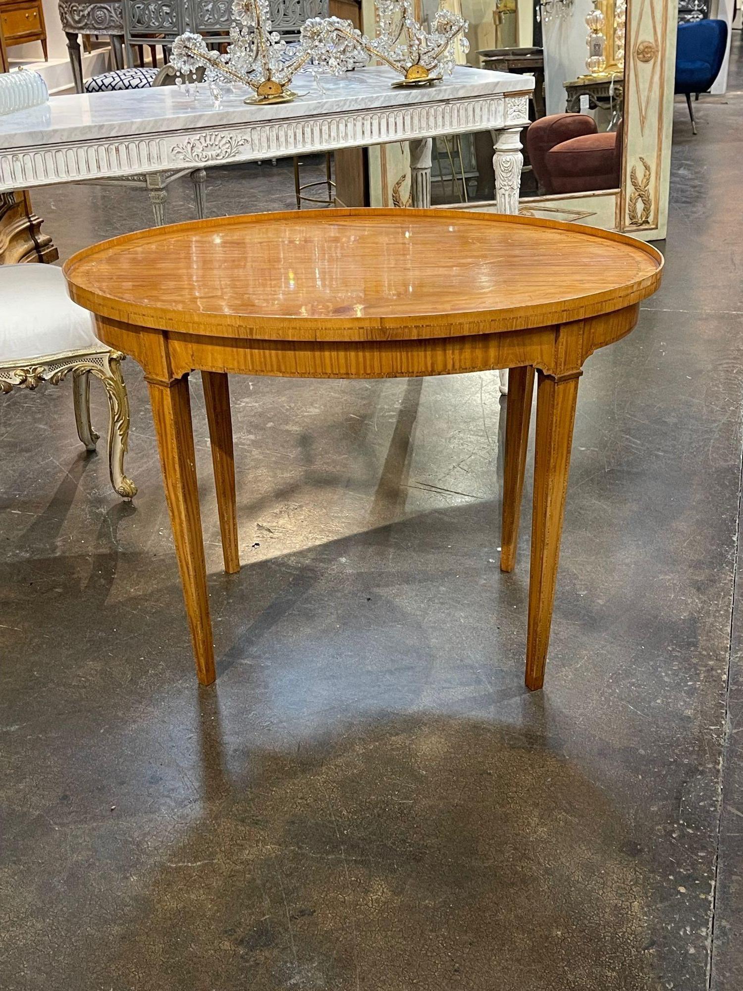 Handsome 19th century Italian oval walnut inlaid side table. Circa 1870. Perfect for today's transitional designs!.