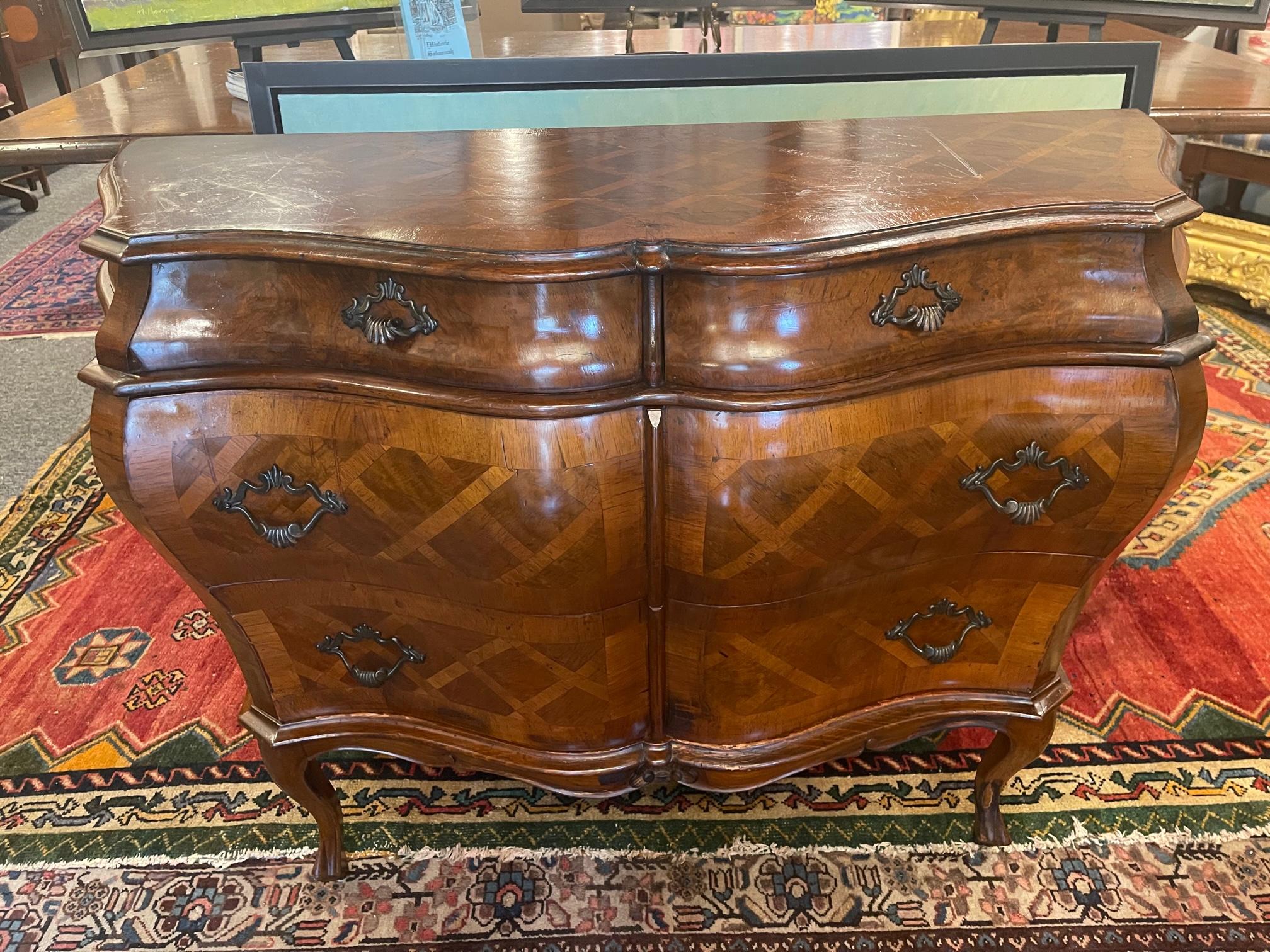 Italian walnut parquetry inlaid bombe sided commode in the 18th Century taste. Two small drawers and two large ones.
 