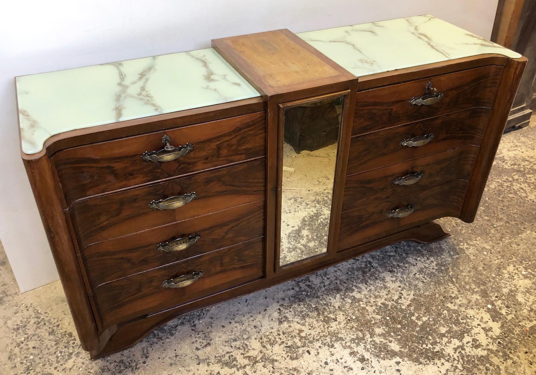 Italian walnut sideboard, original from 1950 with 8 drawers, special design, with opal glass from the glass factory of Pisa. 
The drawers on the sides are also curved.

To find out the cost of transport to USA etc write a message indicating the