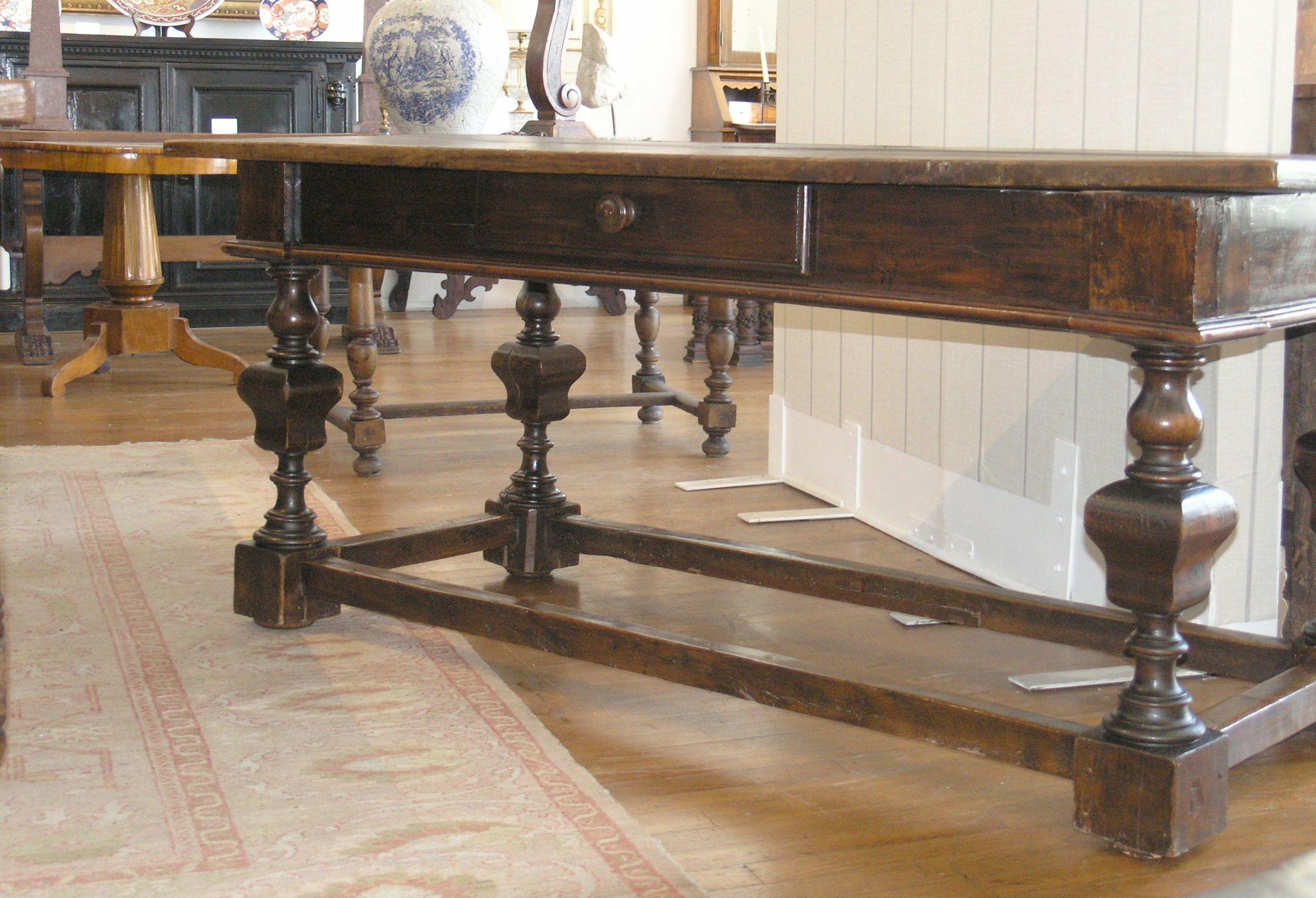 Rectangular top above a long drawer raised baluster legs joined by stretchers.