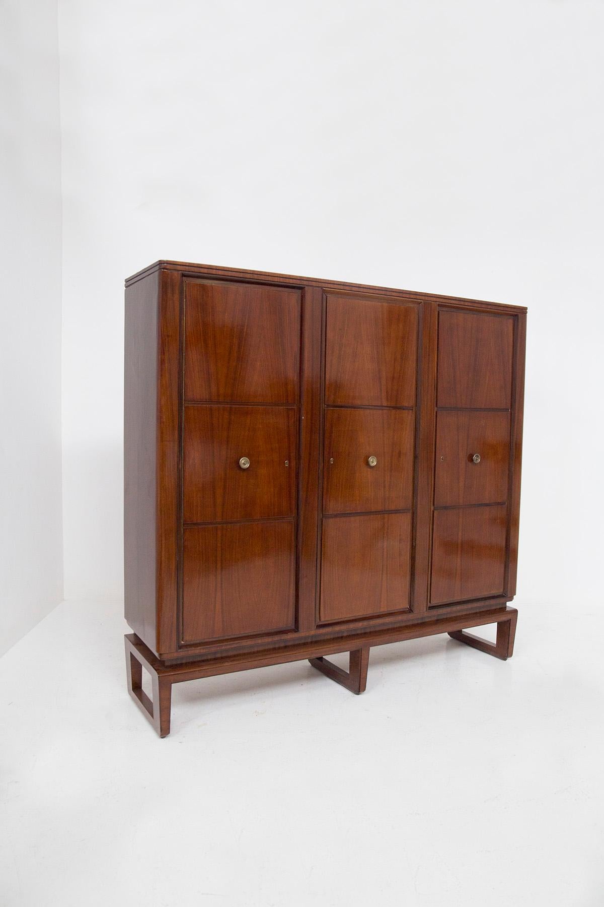 Behold the majestic Mid-Century cabinet designed by Paolo Buffa for the prestigious Italian manufacturer, Serafino Arrighi, dating back to the glamorous 1950s. This imposing piece of furniture is a testament to the enduring allure of Mid-Century
