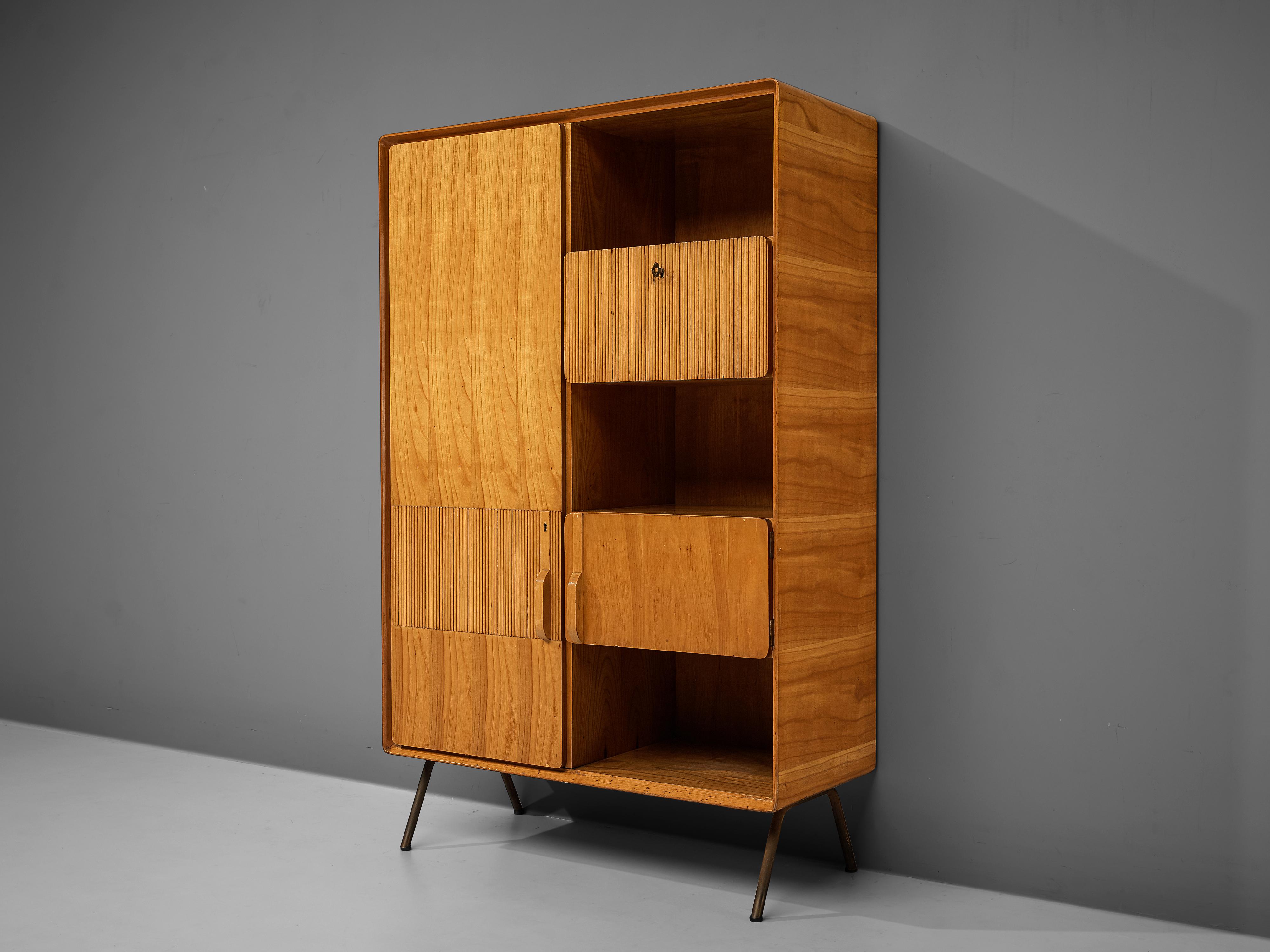 Wardrobe, cherry, mahogany, brass, Italy, 1950s

Elegant Italian wardrobe in cherry with brass legs. The cubic shape of the piece features a door on one side and an open storage as well as two closed compartments on the other side. Together, this