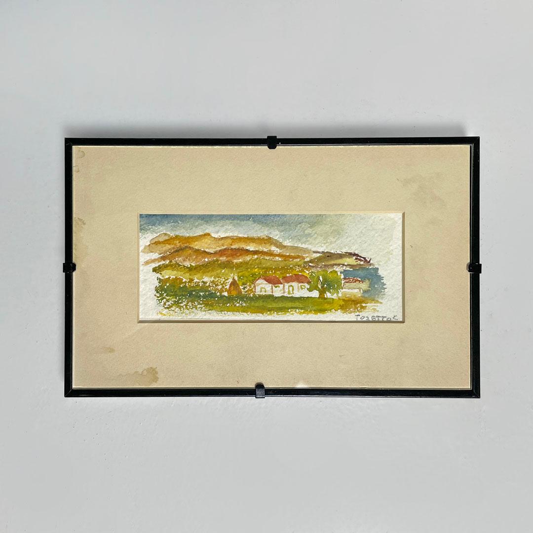 Italienische Aquarell-Landschaftsmalerei mit schwarzem Holzrahmen, 1990er Jahre
Aquarell mit rechteckigem, schwarz lackiertem Holzrahmen und Passepartout. Das Gemälde stellt eine ländliche Landschaft mit zwei Häusern im Vordergrund dar, mit warmen