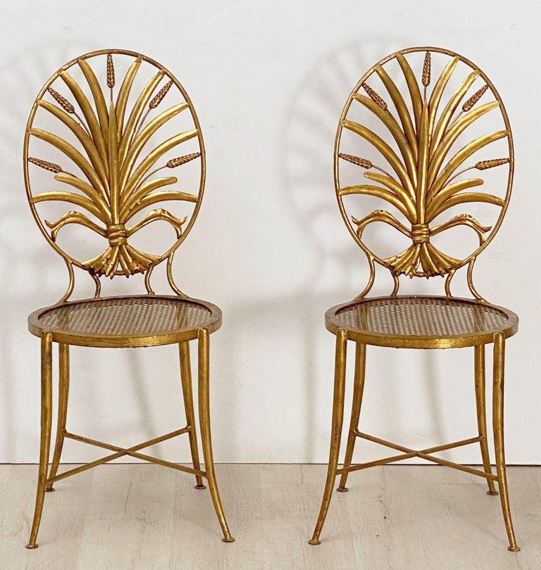 A lovely pair of Italian wheat sheaf chairs by S. Salvadori - Firenze from the Hollywood Regency design era.

Each chair featuring an elegantly detailed back in the design of a sheaf of wheat and resting on slender legs with X stretchers. 

