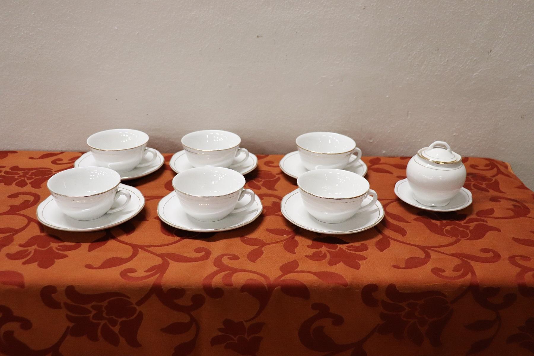 Beautiful fine white porcelain coffee set 15 pieces signed Bavaria, 1980s. The service is complete to serve six people at the table includes: 1 sugar bowl, six cups with saucers for coffee or tea. Refined decoration with gold borde. High quality