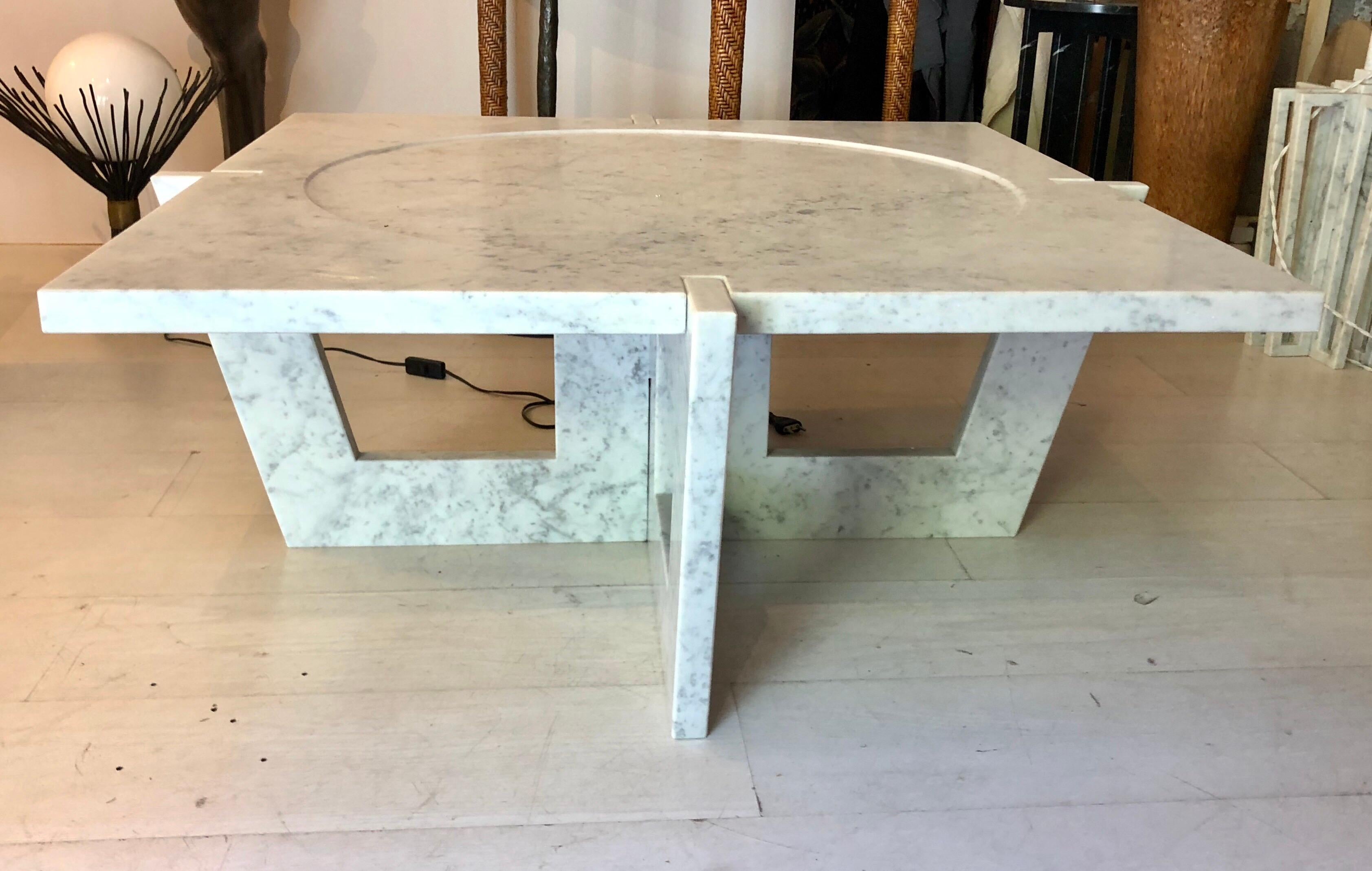 Elegant, timeless Italian midcentury style modern coffee table in Italian white Carrara marble by Massimo Mangiardi. 

This is a custom made piece; no returns are possible.

Also available in black Marquina marble and in custom sizes.