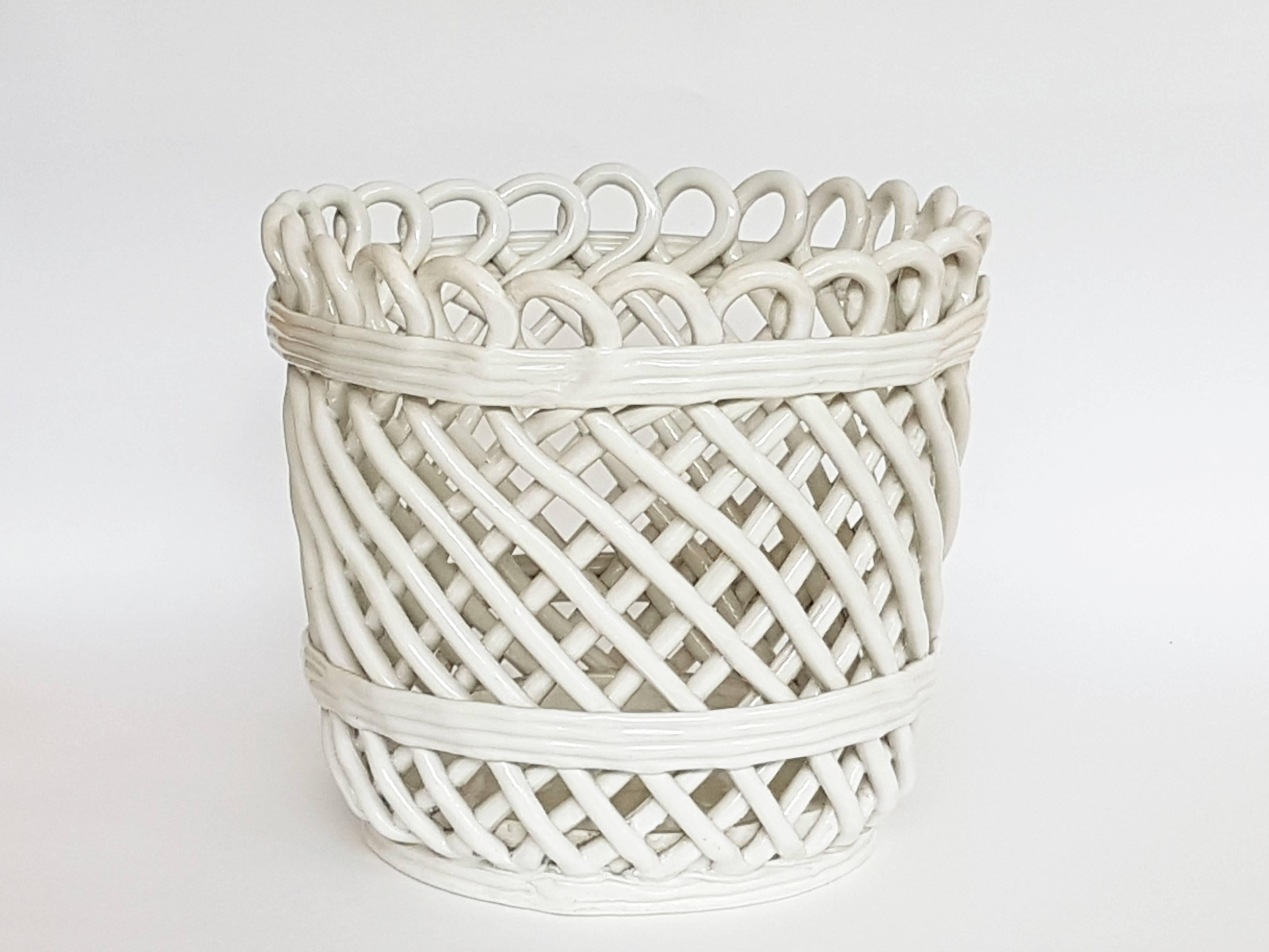 This basket shape ceramic cachepot was manufactured in Italy by SCI (Società Ceramica Italiana) Laveno, circa 1950. It was made from white glazed ceramic and remains in a very good vintage condition: wear consistent with age and use such as the few