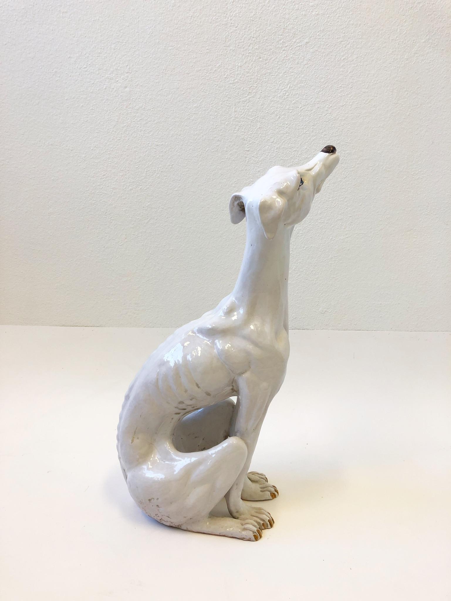 Beautiful Italian white ceramic blue eyes greyhound statue from the 1970’s.
Measurements: 26” high, 14” wide and 8” deep.
