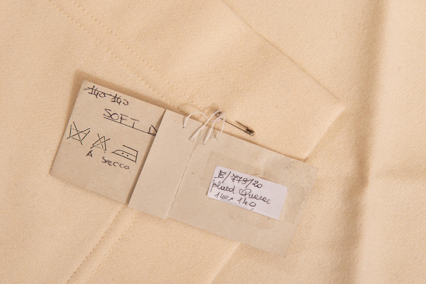 Pure wool cloth by an Italian Art Studio, named Studio Quasar in Turin.
The cover is all pure wool, cream color: this is why You cannot see well it in photo.
Soft and elegant.