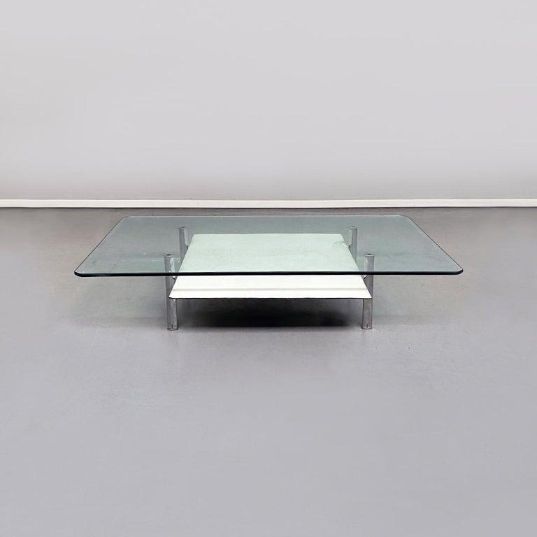 Italian Mid-Century Modern white coffee table Diesis by Antonio Citterio and Paolo Nava for B&B Italia, 1970s 
White coffee table Diesis, with double shelf, one in transparent ground glass and the other covered in white leather and with steel legs.