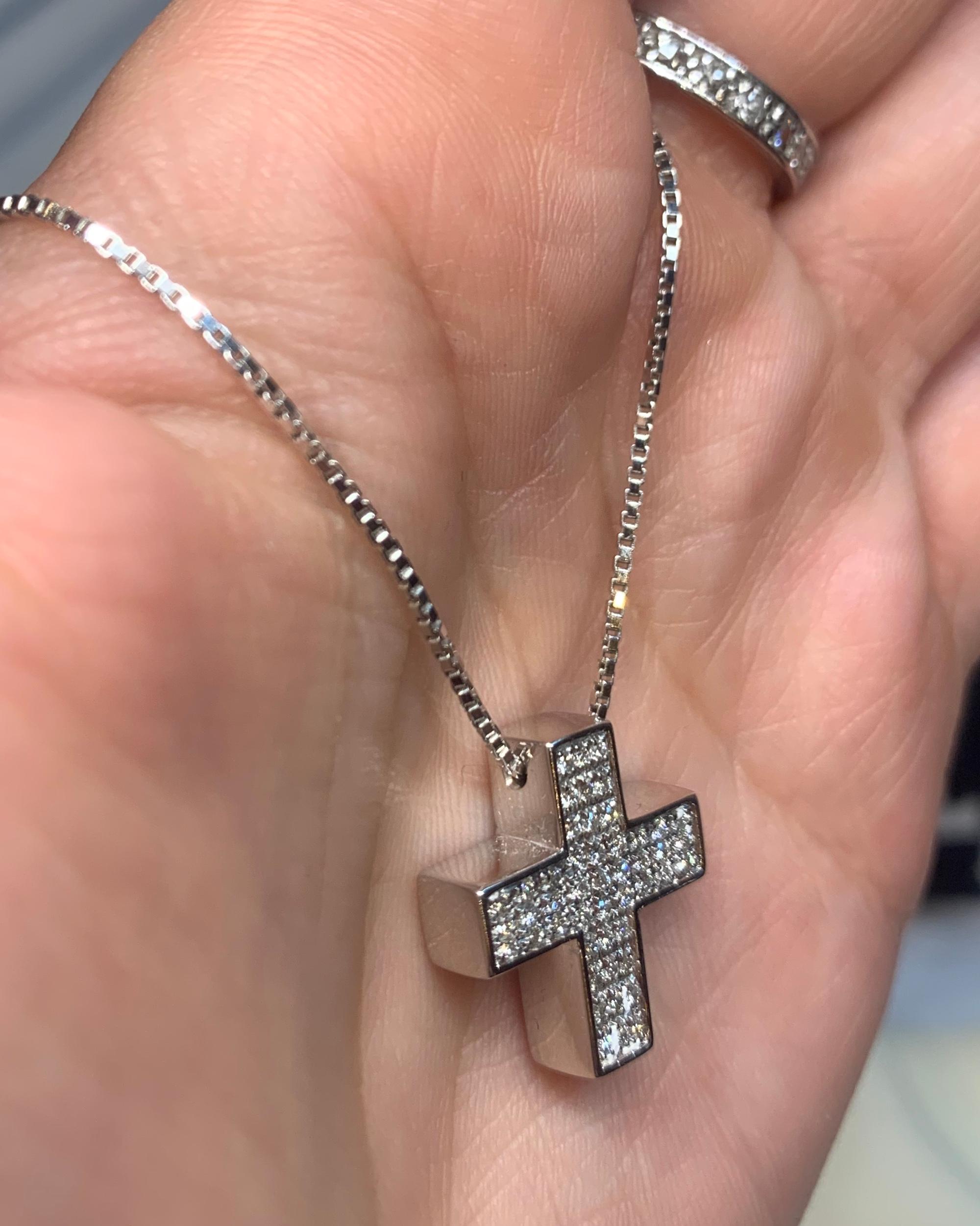 Please see video- this is a beautiful cross.
More Details:
0,50ct White VS-G Brilliant Cut diamonds
Handset in 9,90gr 18k White Gold
Handmade in our 150 year old workshop in Italy
Measuring approximately 2.5cm by 2cm 

A beautiful example of a twist
